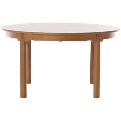 Scandinavian Modern Round to Oval Oak Dining Table with Brass Detail