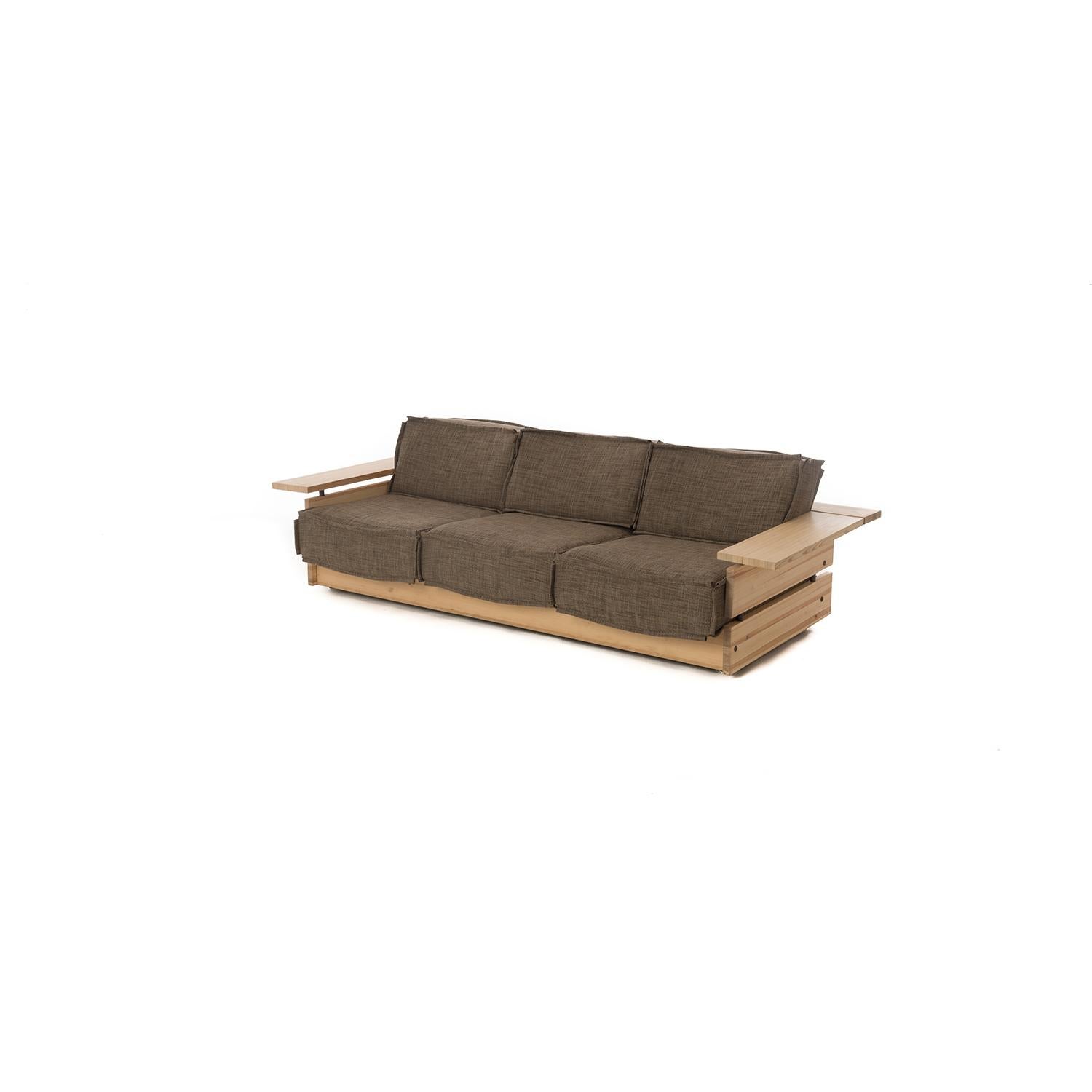 A Hameen Kalustaja (Finland) design. Contemporary sensibility, vintage Scandinavian style. This three seat sofa offers up a clean rustic pine frame with new upholstery in a neutral wool- blend by Casamance. This would be a great piece to sink into
