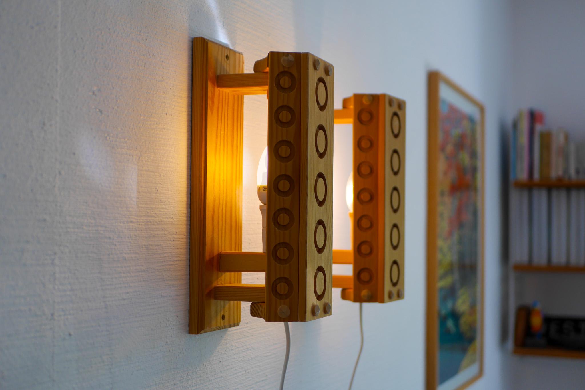 Late 20th Century Scandinavian modern sconces. A pair of Mid-century modern Pine wood wall lights For Sale