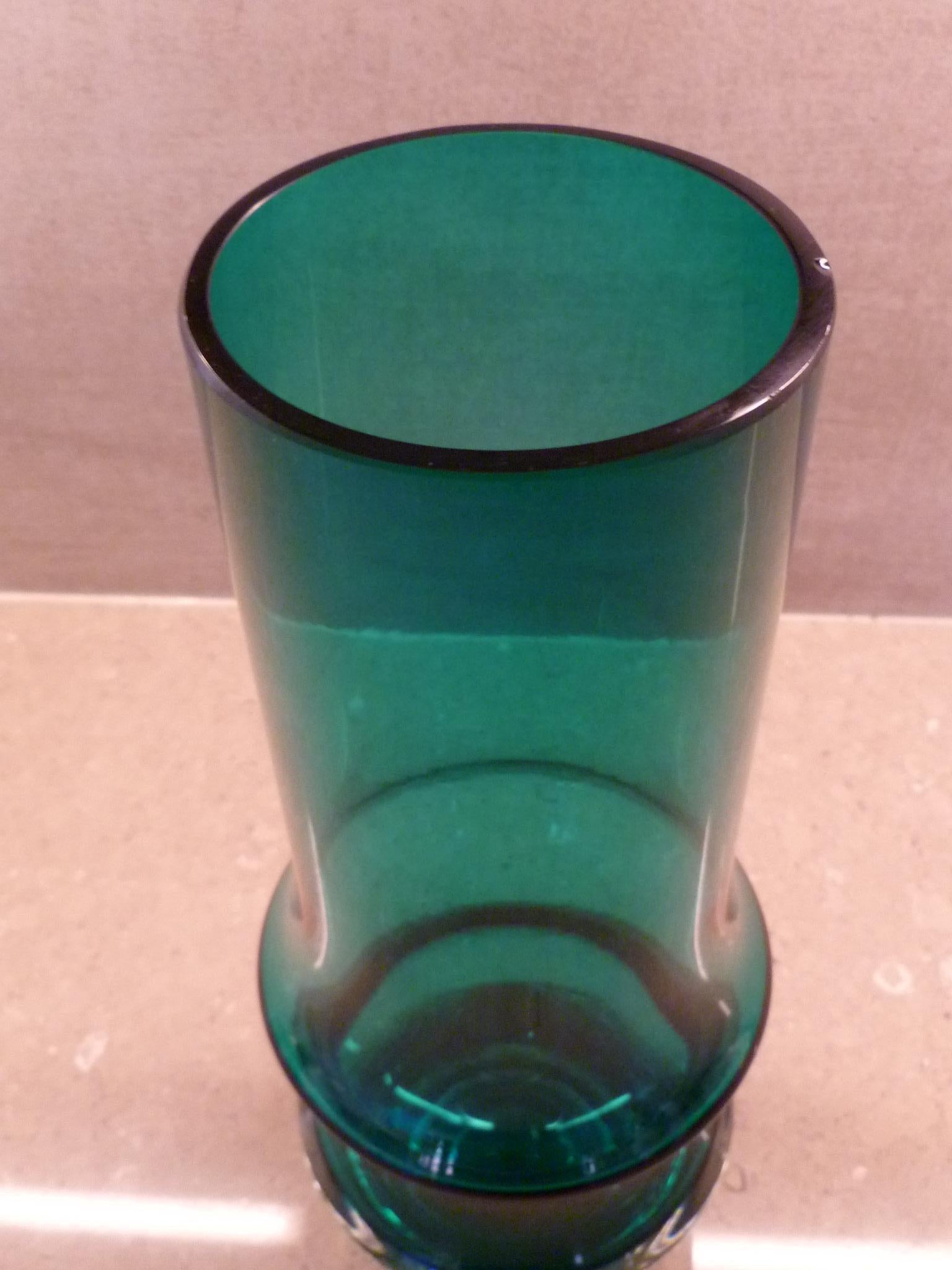 Great sculptural turquoise glass vase by Tamara Aladin for Riihimäki or later spelled Riihimaen glass factory in Finland designed in the 1970s.  Nice large size perfect for large bouquet of flowers. The vase has remnants of the clear logo label of