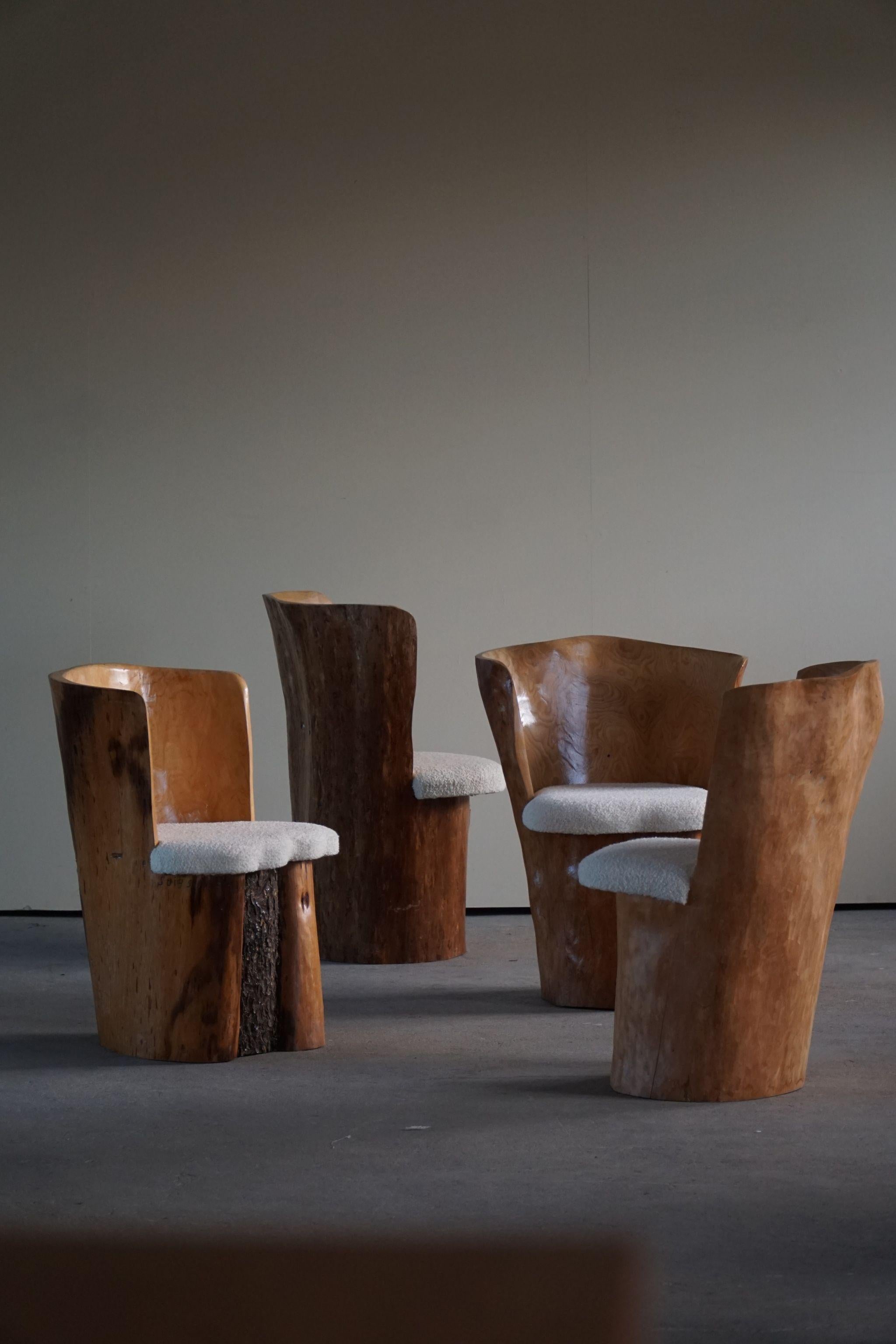 A truly unique dining set of 4 stump chairs, made in solid pine and reupholstered in bouclé wool. Hand carved in Sweden by a local cabinetmaker Stig Sundahl. Dated 1983-1987.

Such a decorative set for the modern interior and a great opportunity