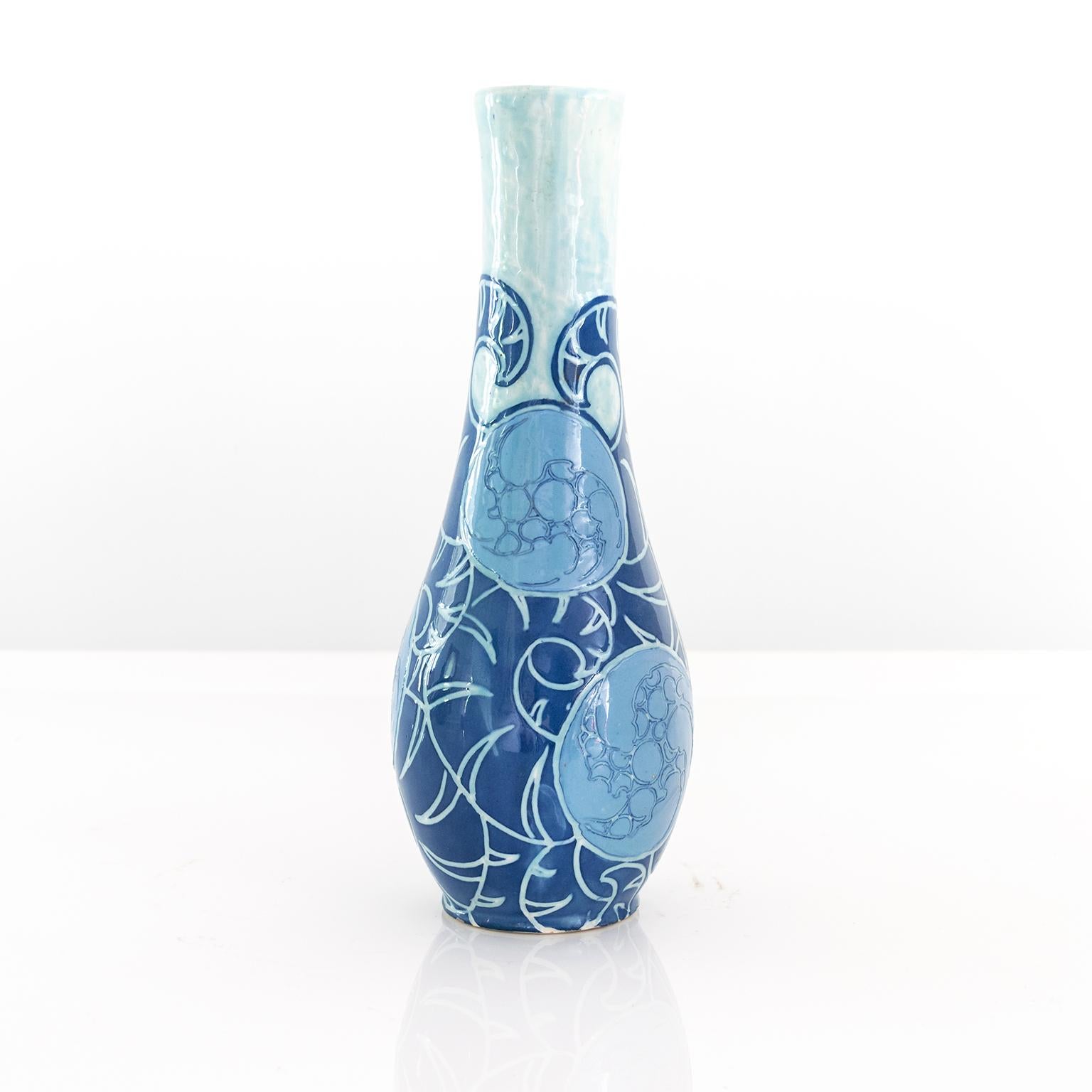 A Swedish Art Nouveau sgraffito vase in blues designed by Gunnar Wennerberg for Gustavsberg, 1905.

Measures: Height: 11”.