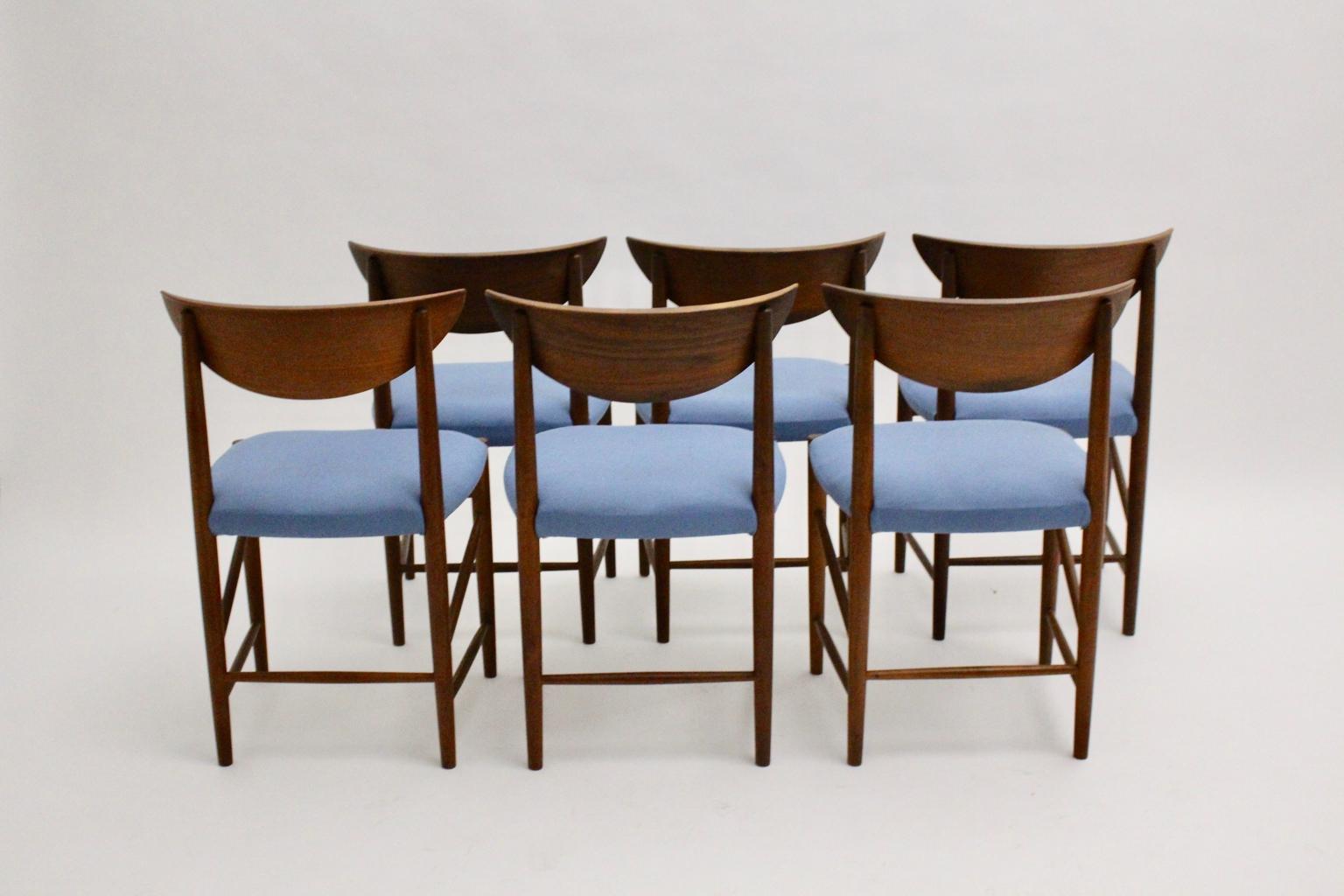Scandinavian Modern vintage organic dining chairs or chairs from teak designed by Peter Hvidt and Orla Moolgard Nielsenfor Søborg Mobler DK, circa 1956.
These wonderful dining chairs feature a sculptural teak frame with beautiful warm wooden tone,