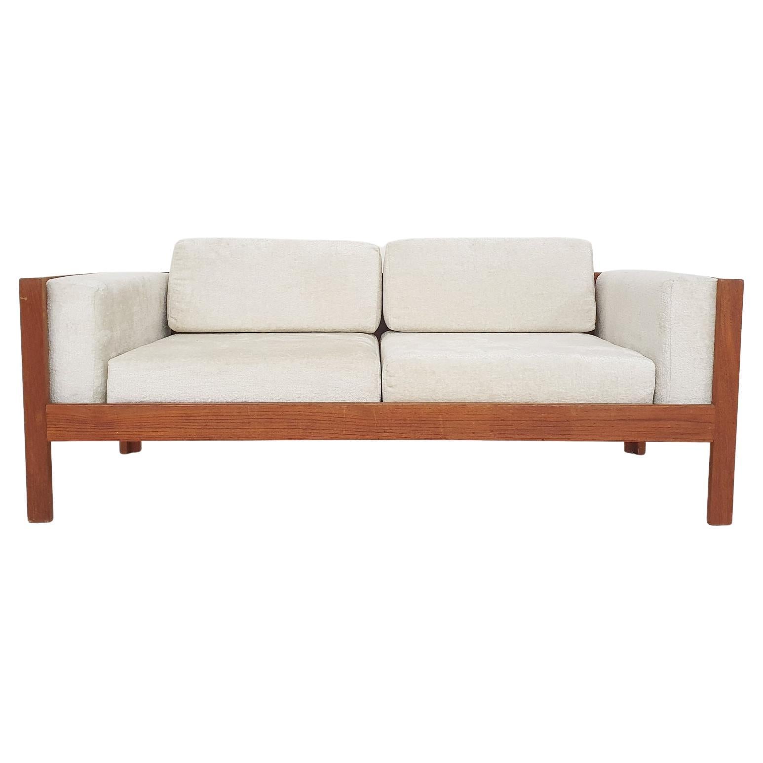 Scandinavian modern sofa in teak and boucle, 1960's For Sale