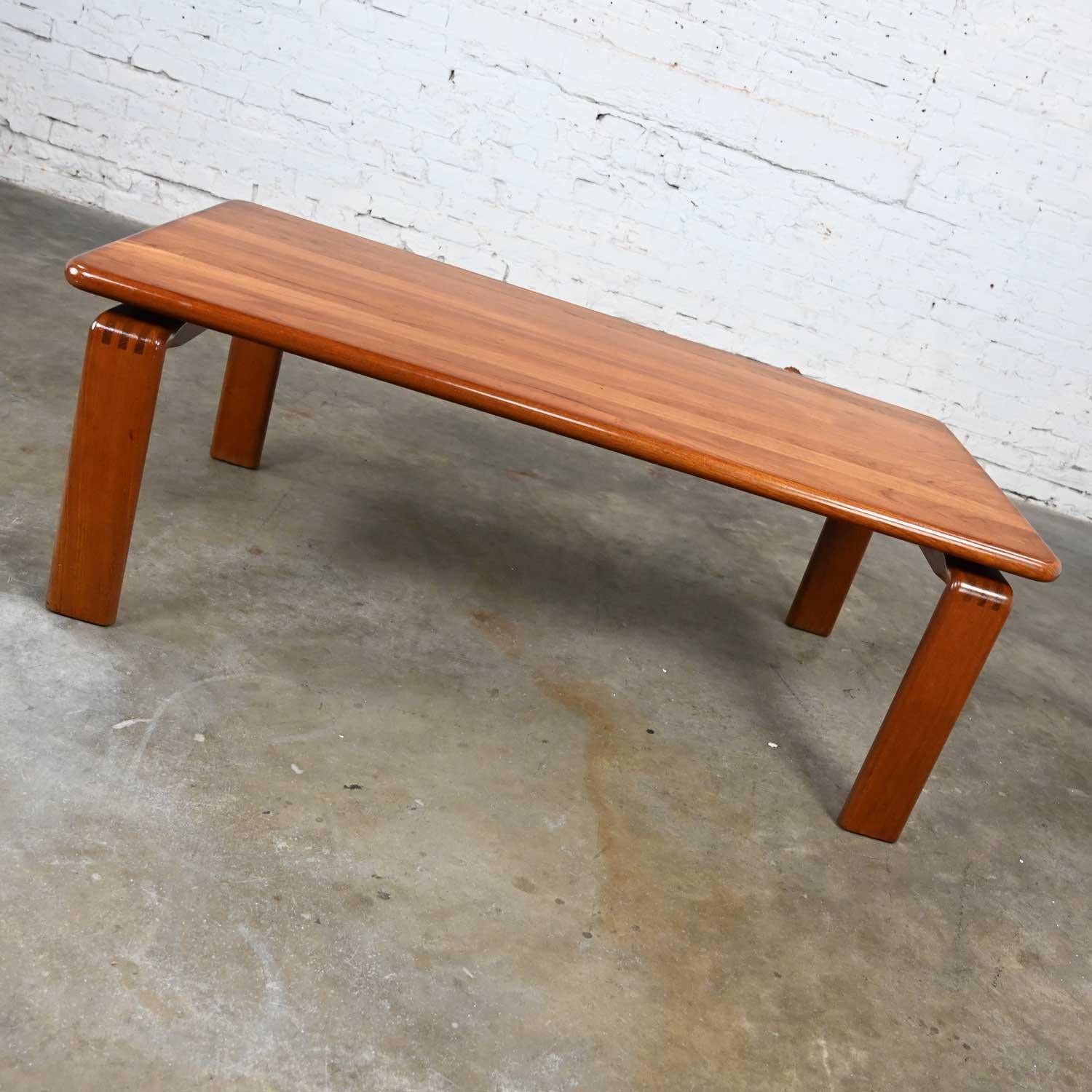 Gorgeous vintage Scandinavian Modern solid teak rectangular coffee table with rounded corners and a glass overlay in the style of Westnofa, Norway. Beautiful condition, keeping in mind that this is vintage and not new so will have signs of use and