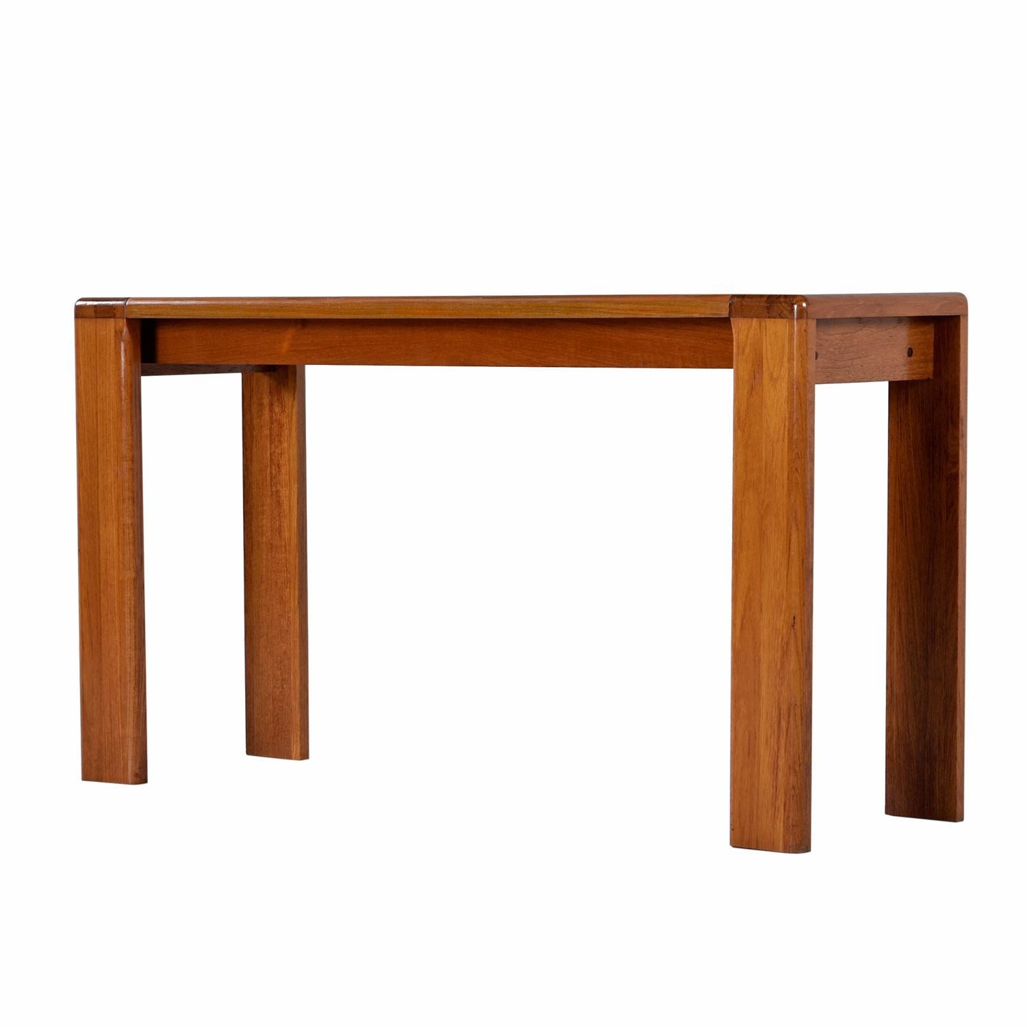 Vintage solid teak console table constructed of thick bands of teak planks laid side by side to create a solid tabletop surface. The Minimalist form adheres to the Danish Modern aesthetic. The legs are also solid teak. Also ideal for use as a sofa