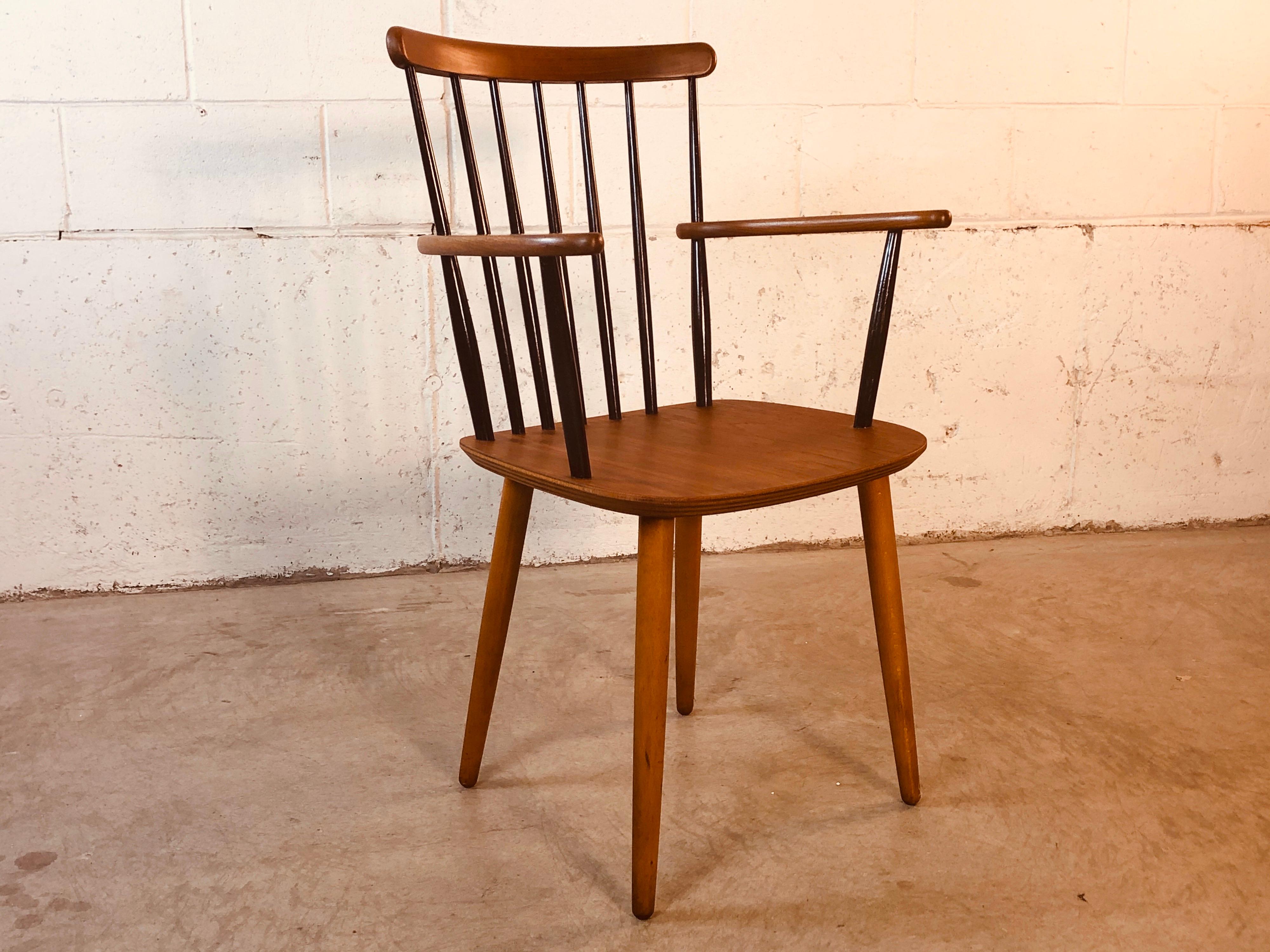 Vintage 1960s Scandinavian Modern teak and birch spindle back arm chair with black painted accents. The chair is manufactured by Billund Stolefabrik, Denmark. Excellent refinished condition. Chair is sturdy. Marked underneath.