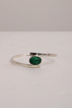 Scandinavian Modern Sterling Silver bracelet by Isaac Cohen with green stone.