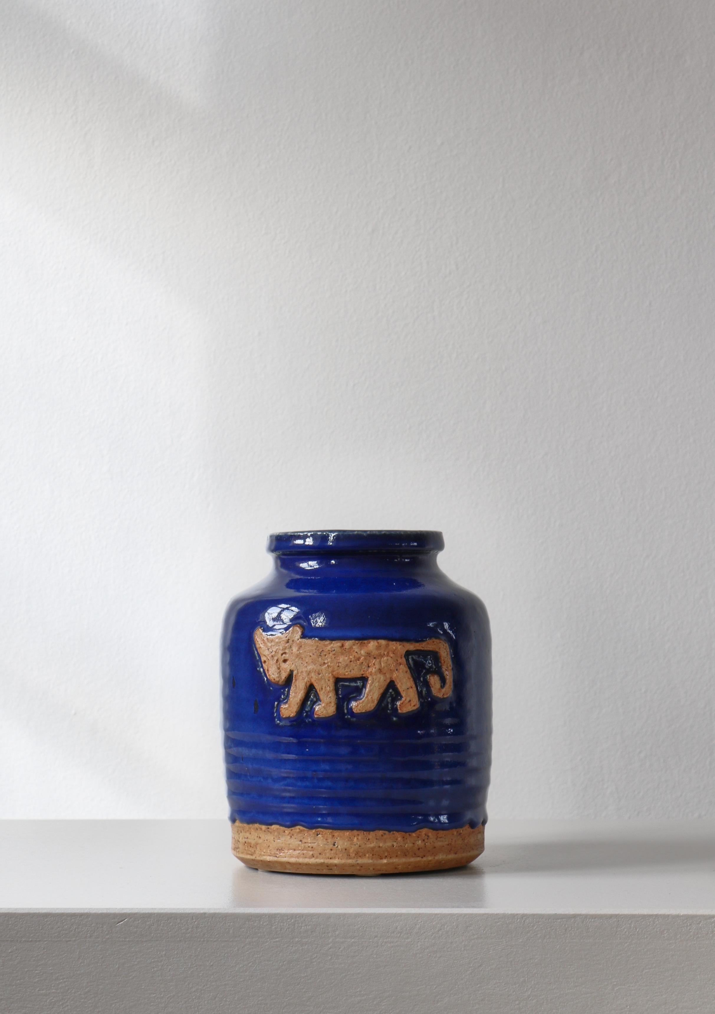 Unique stoneware vase made by Danish artist Jørgen Mogensen at Royal Copenhagen in the 1960s. Chamotte clay with relief decor and thick blue glazing. Signed 