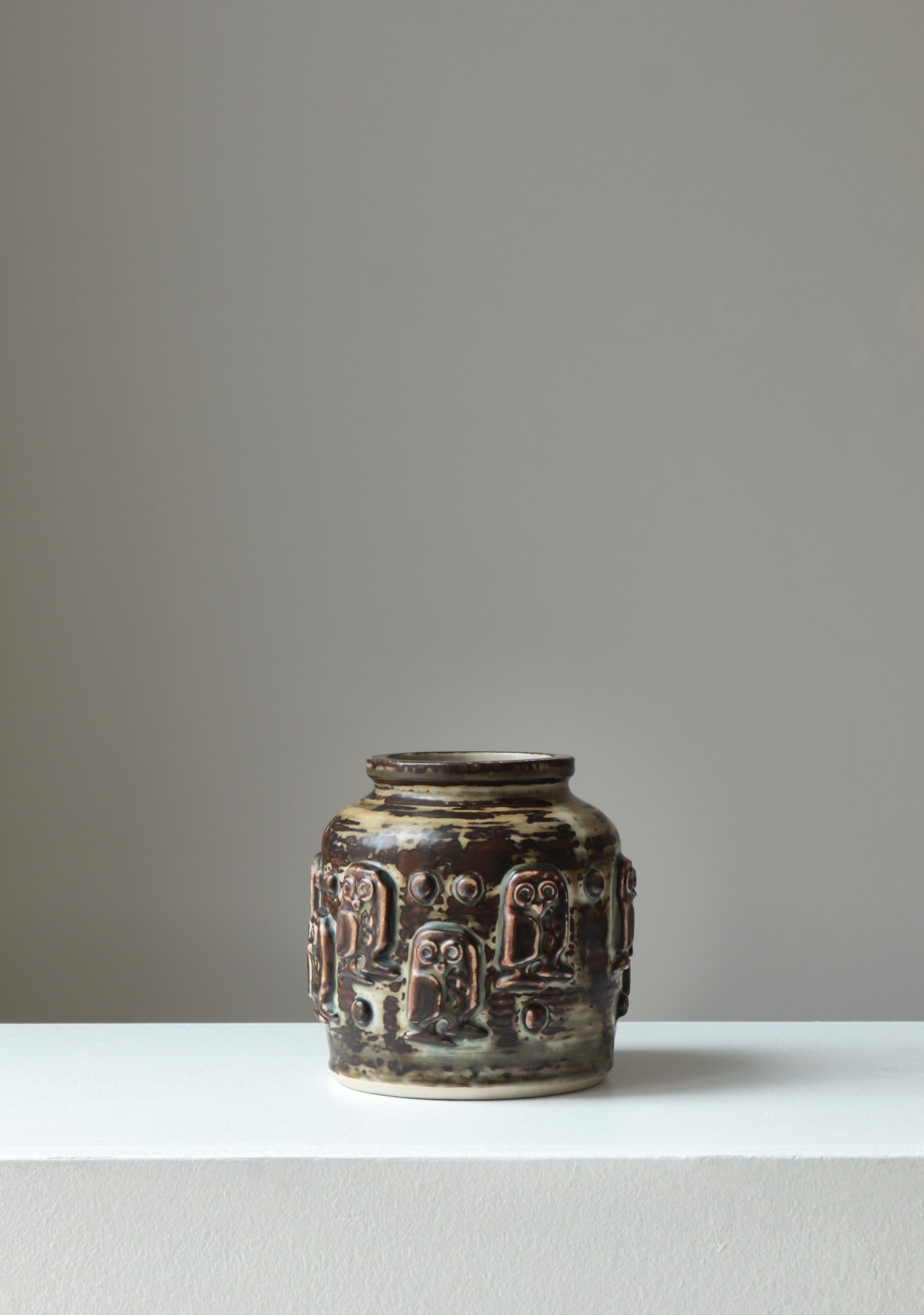 Handmade stoneware vase model 21488 with Sung glazing by Danish artist Jørgen Mogensen for Royal Copenhagen in the 1960s. Relief decor with owls. Signed 