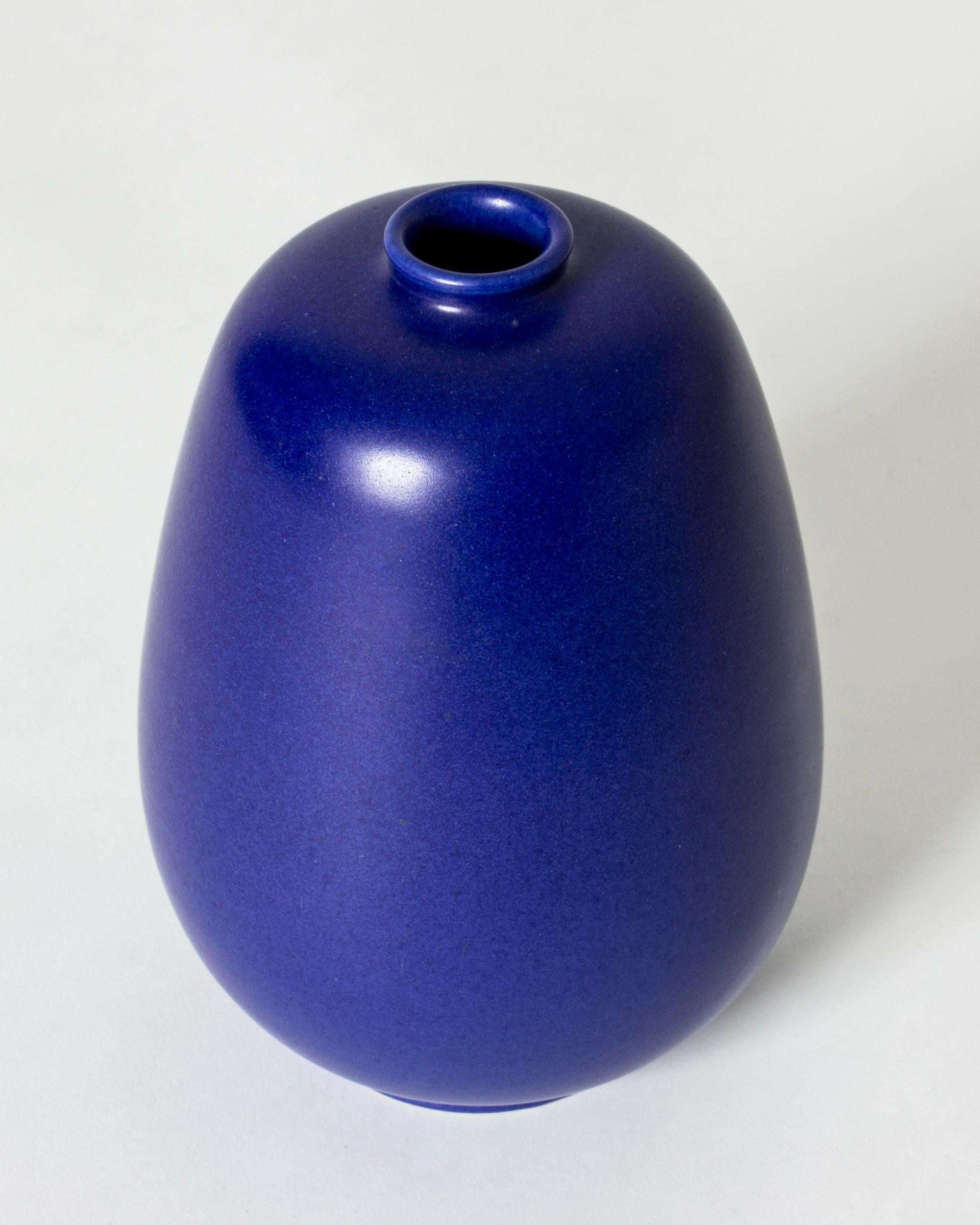 Striking stoneware vase by Eric and Ingrid Triller, in a streamlined, compact shape. Beautiful, opaque cobalt blue glaze.

Fleeing World War II, German potters Eric and Ingrid Triller settled in the industrial village Tobo and started making their
