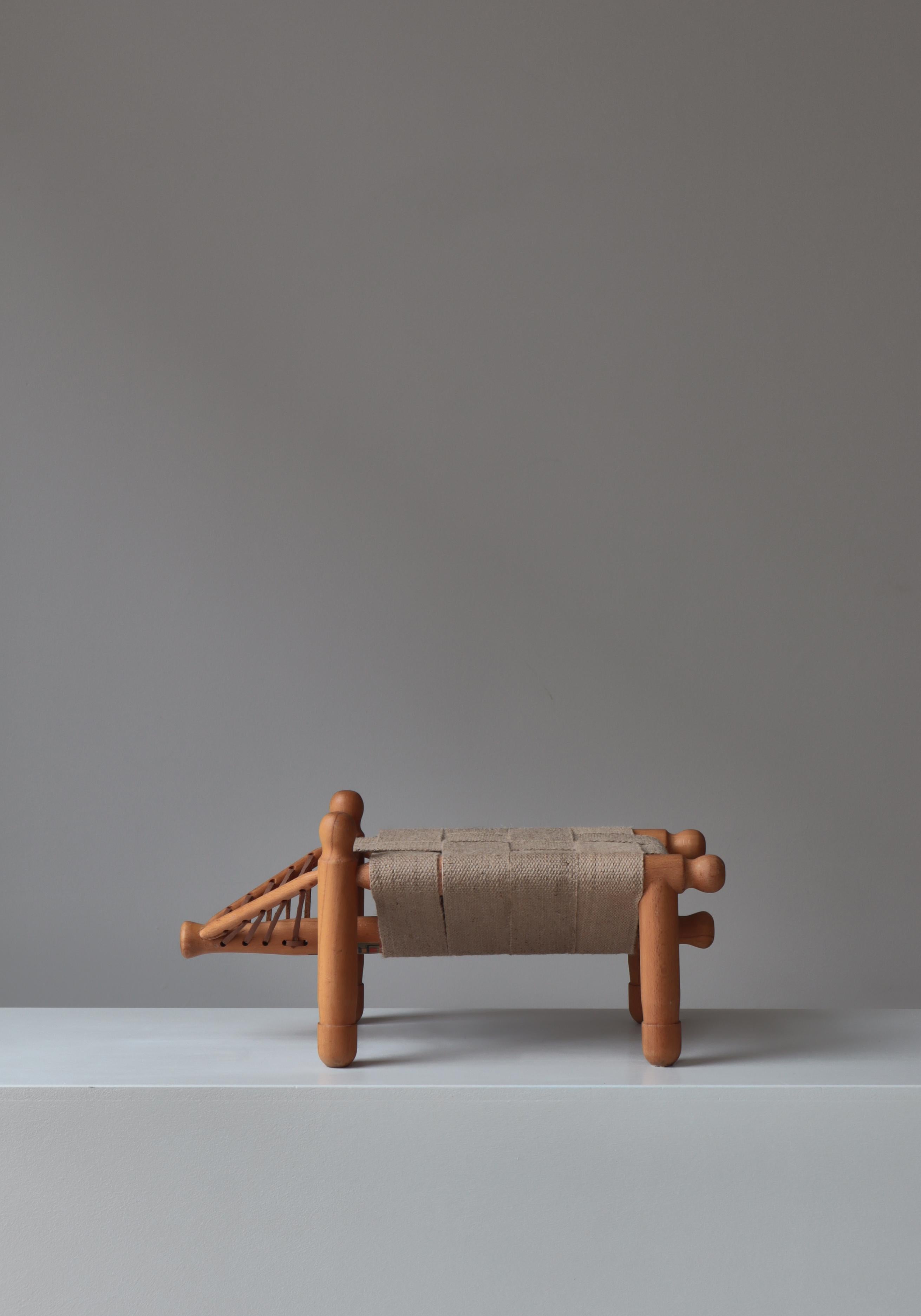 Playful stool by Swedish designer Erik Höglund made of beech, hemp webbing and leather. Model nicknamed 