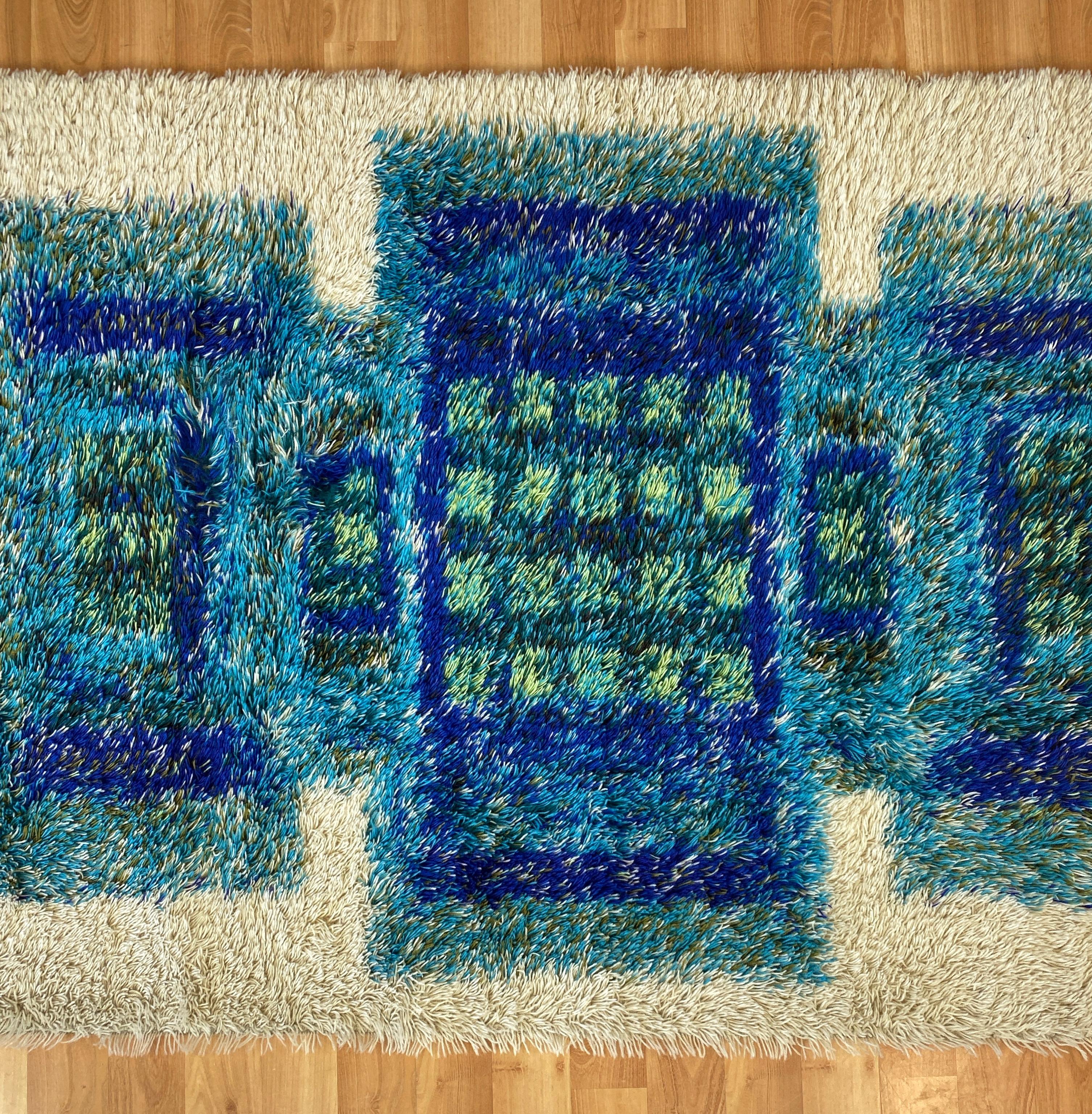blue and green geometric rug