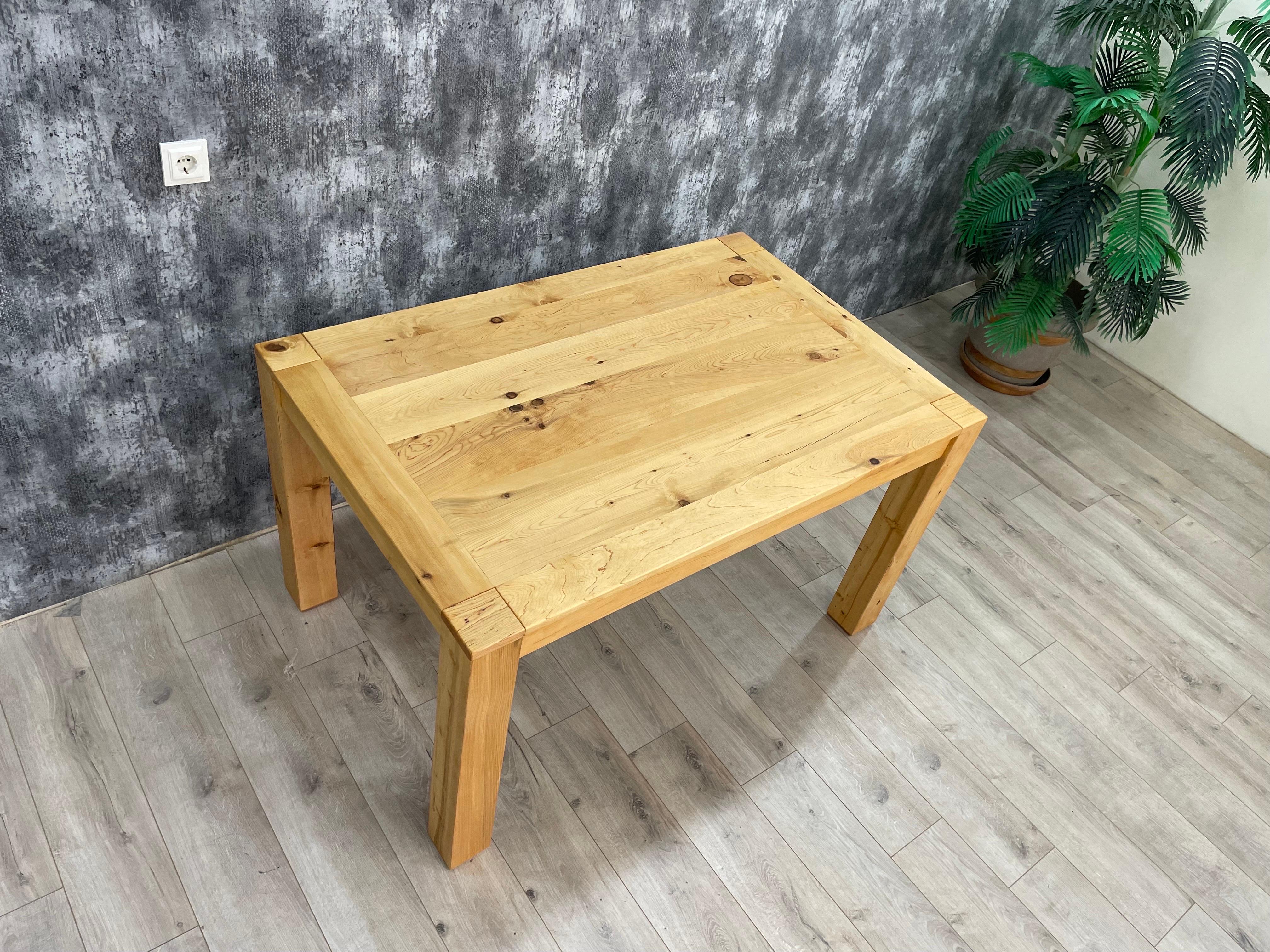 Arasta can be a good choice for your Scandinavian Modern style living room if you prefer to have your dining table in solid wood. Cedar wood has a light color tone, decay- and weather resistant and its scent repels insects. 
The best Cedar wood has