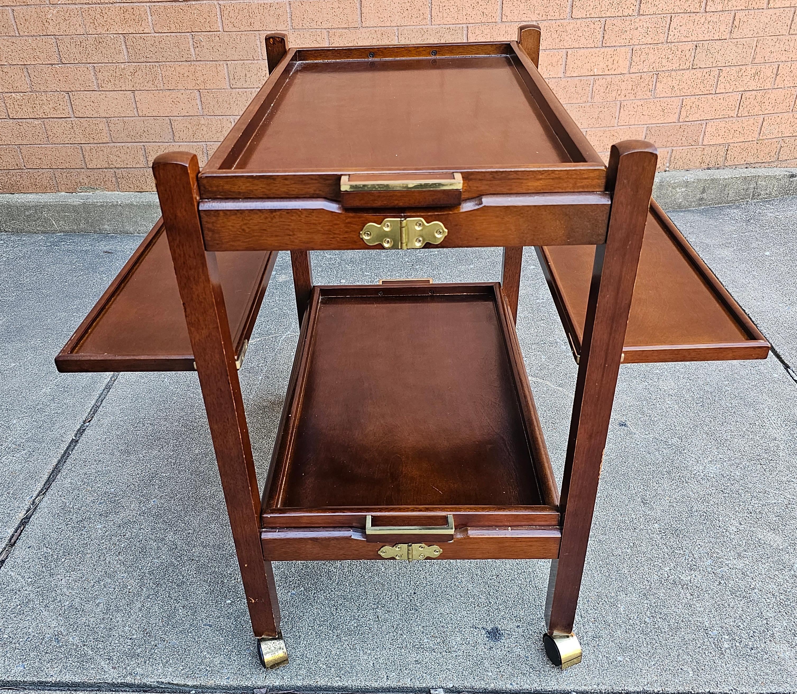 A Scandinavian Modern Style Two-Tier Fold-Up Rolling Bar Cart with two Removable Trays and two fold-up leaves.
Measures 31