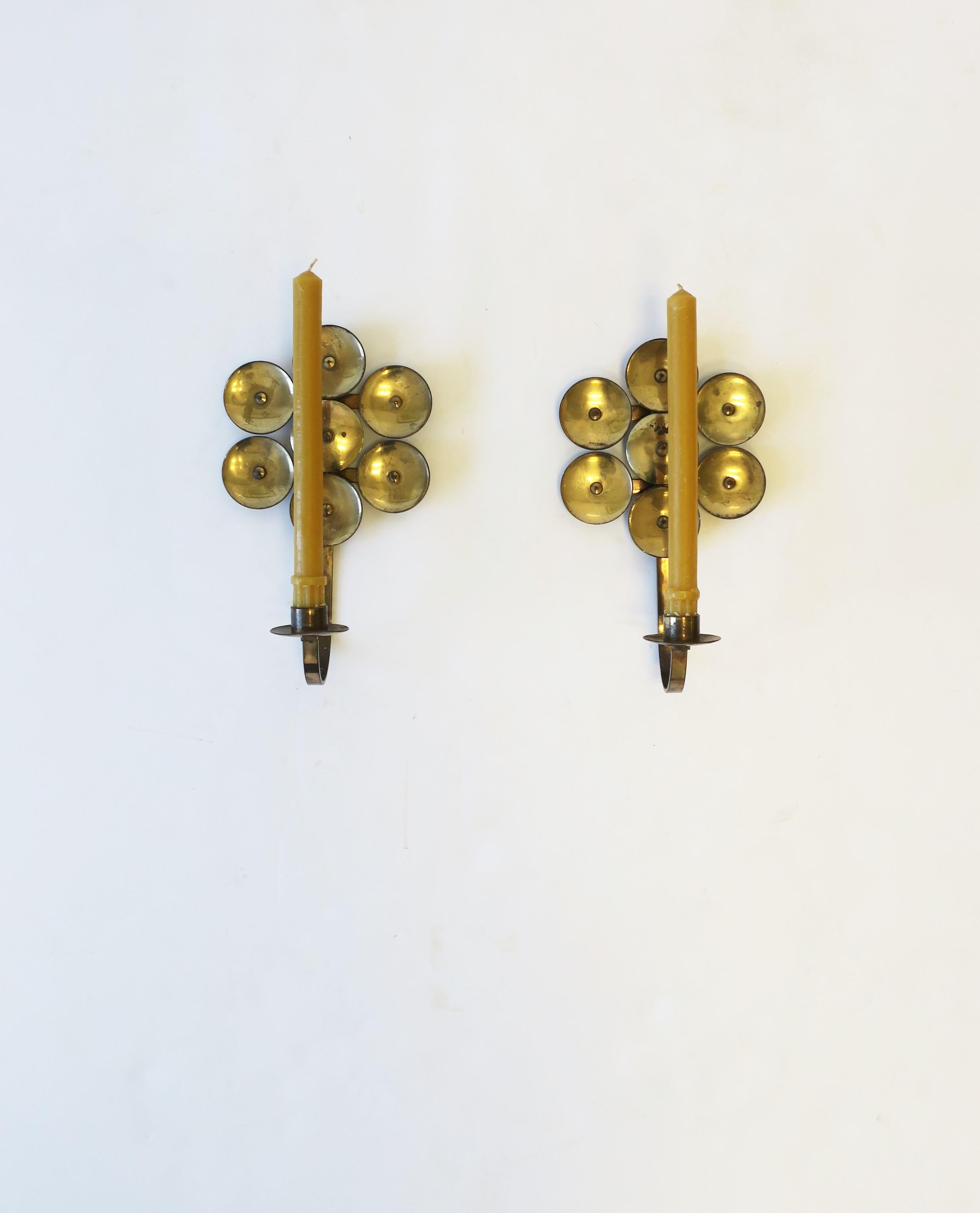A pair of Scandinavian Modern Swedish brass candle wall sconces, circa mid-20th century, 1960s, Sweden. With maker's mark and origin mark on back as show in images #17 and 18. Dimensions: 5.5 W x 9.5