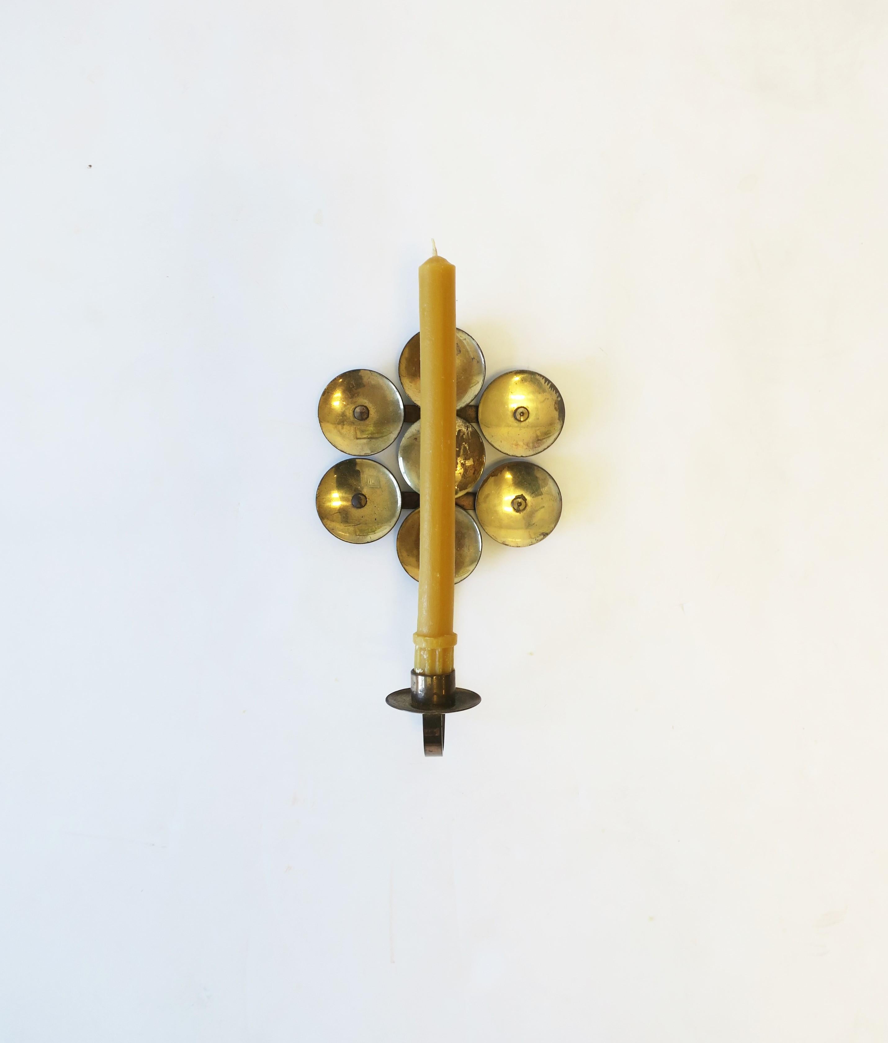 A brass Scandinavian Modern Swedish wall candle sconce, circa mid-20th century, 1960s, Sweden. With maker's mark and origin mark on back as shown in images #9 and 10. Dimensions: 5.5 width x 9.5