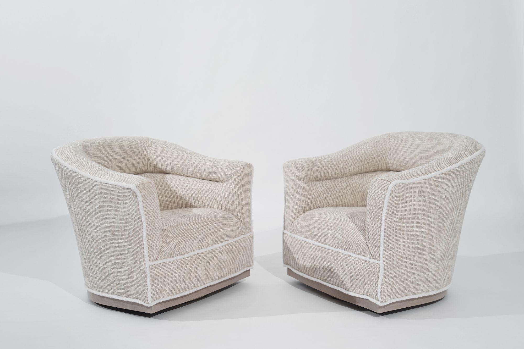 Stunning pair of Scandinavian Modern swivel chairs, originating from Sweden and crafted in the 1950s. Meticulously restored by Stamford Modern, these chairs have been brought back to their original glory, showcasing the timeless elegance of