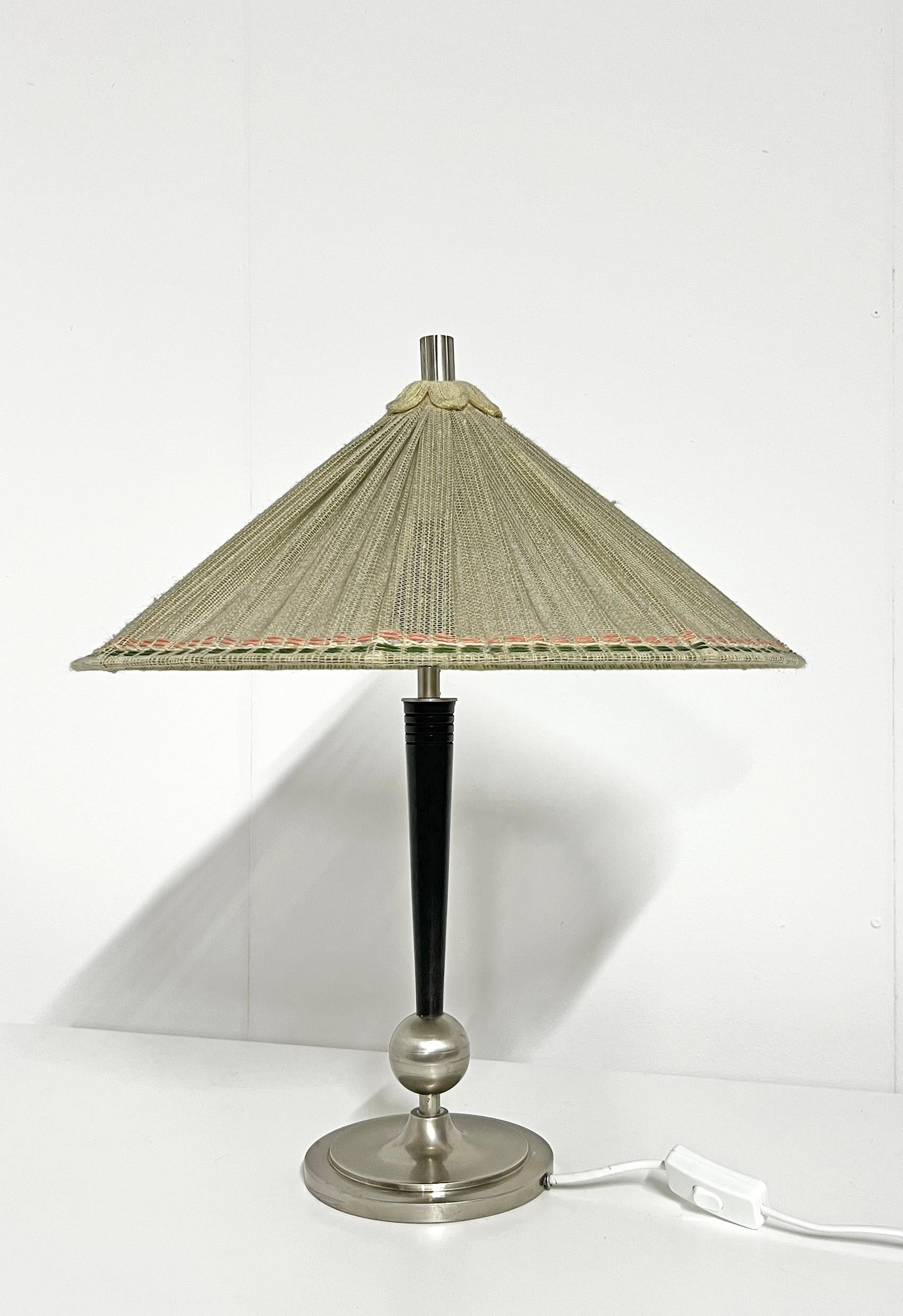 Rare, scandiavian modern table lamp from Arvid Böhlmarks Lampfabrik, attributed to Harald Notini. 
Wear and patina consistent with age and use. 
Pewter patina, scratches and marks. Smaller damage to the wood, as seen on the last picture. 
Please