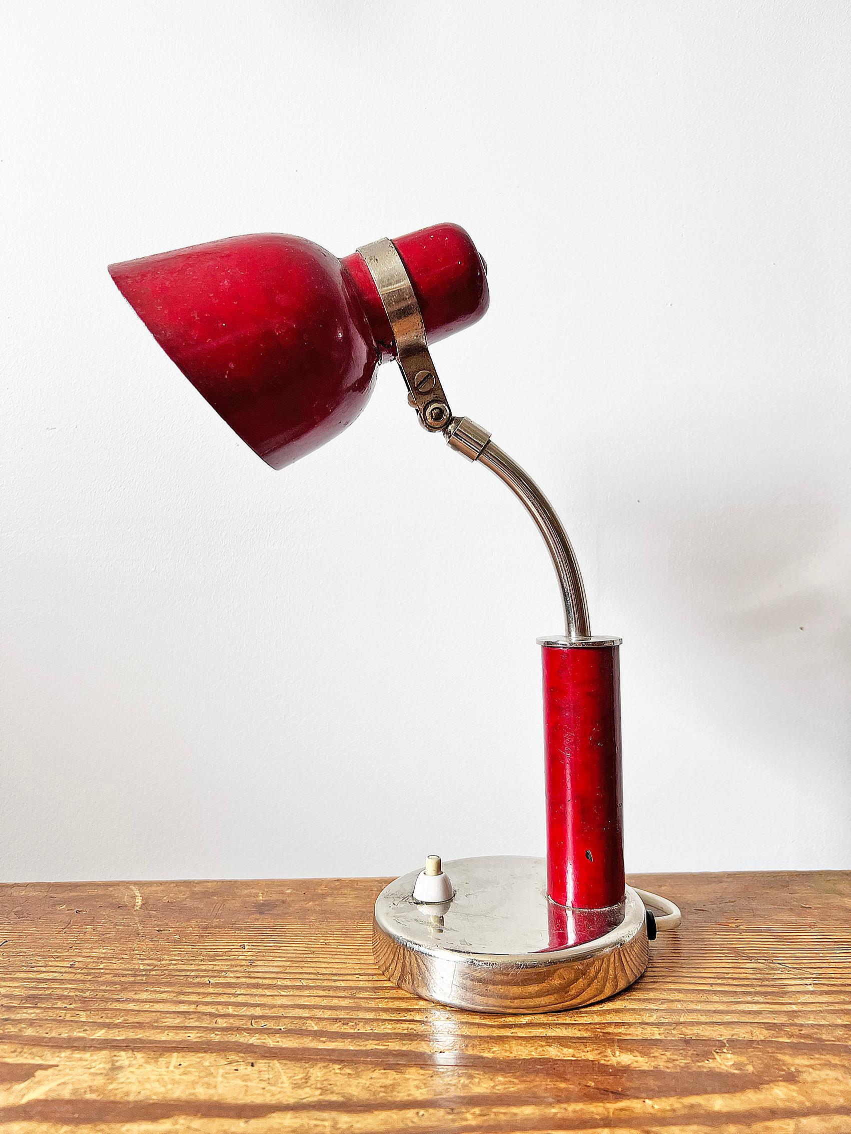 Table or wall lamp from most likely Nordiska Kompaniet, NK. Produced in Sweden during ca 1930-1940's. Adjustable in angle. The lamp can also be hung as a wall lamp. 
Condition: Wear and patina consistent with age and use. Repainted. Color loss,