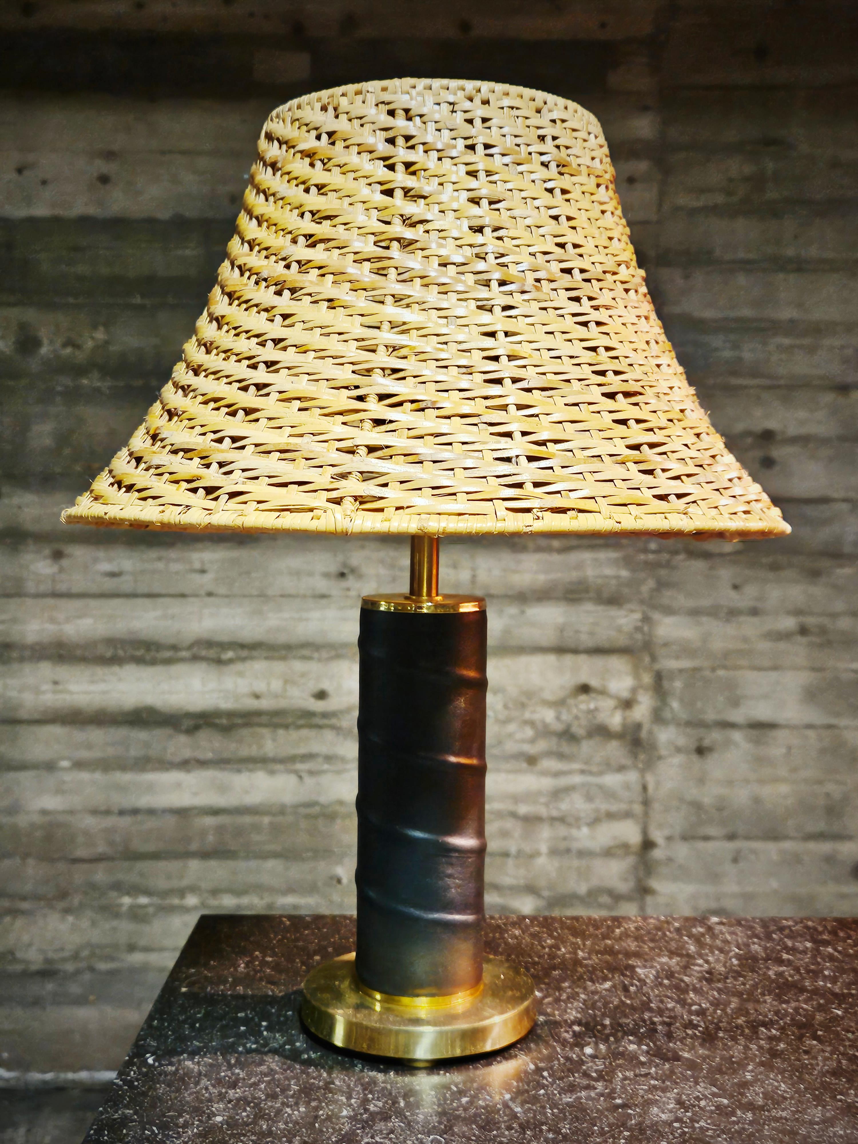Beautiful table lamps made in Denmark in the middle of the 20th century. Thick brass neck wrapped in black high quality leather. 

Elegant design in the style of Bertil Brisborg and Scandinavian modern. 

Shades not included.