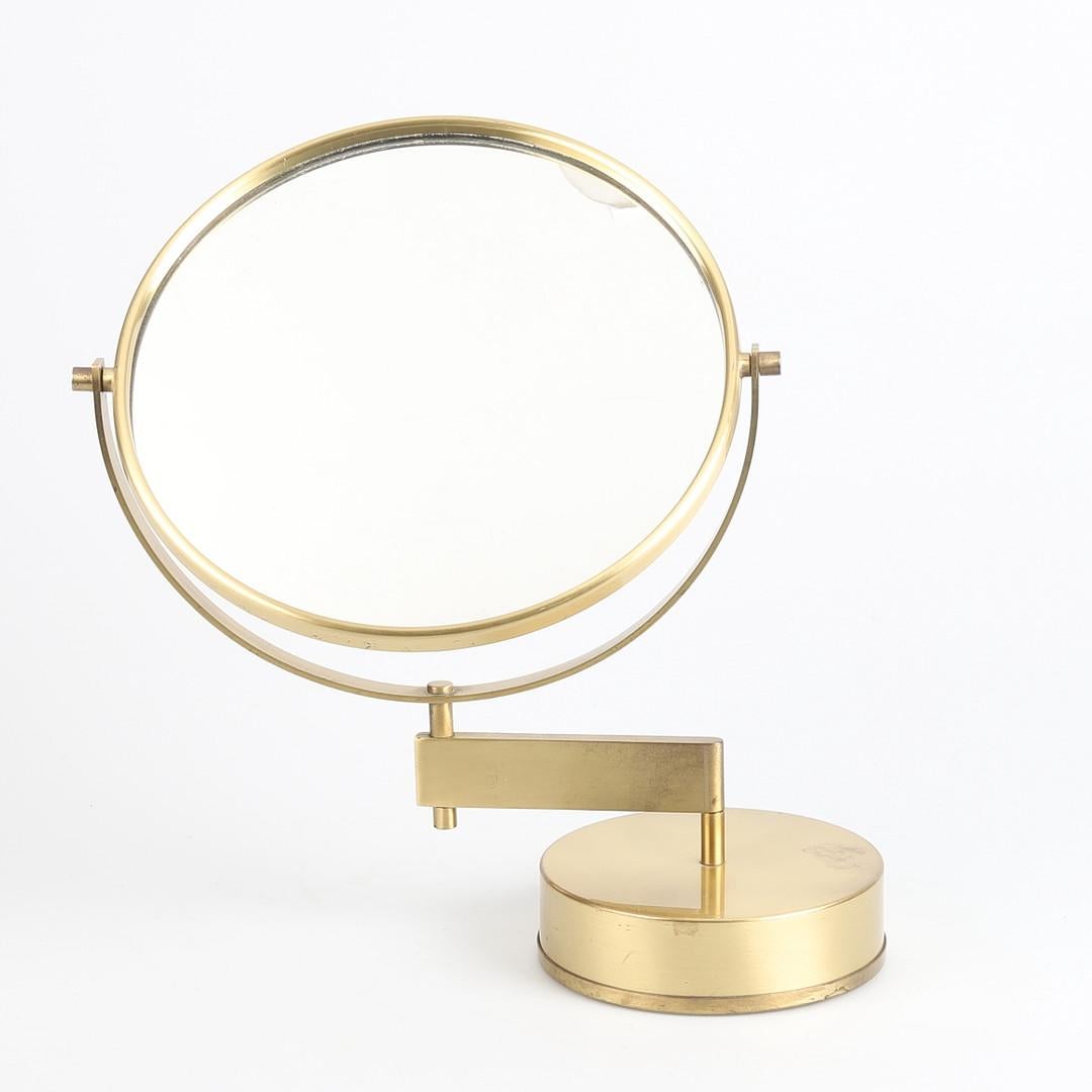 Elevate your interior with the timeless charm of the Scandinavian Modern table mirror by the acclaimed designer Hans-Agne Jakobsson. Crafted with meticulous attention to detail, this mirror embodies the essence of Scandinavian design – simplicity,