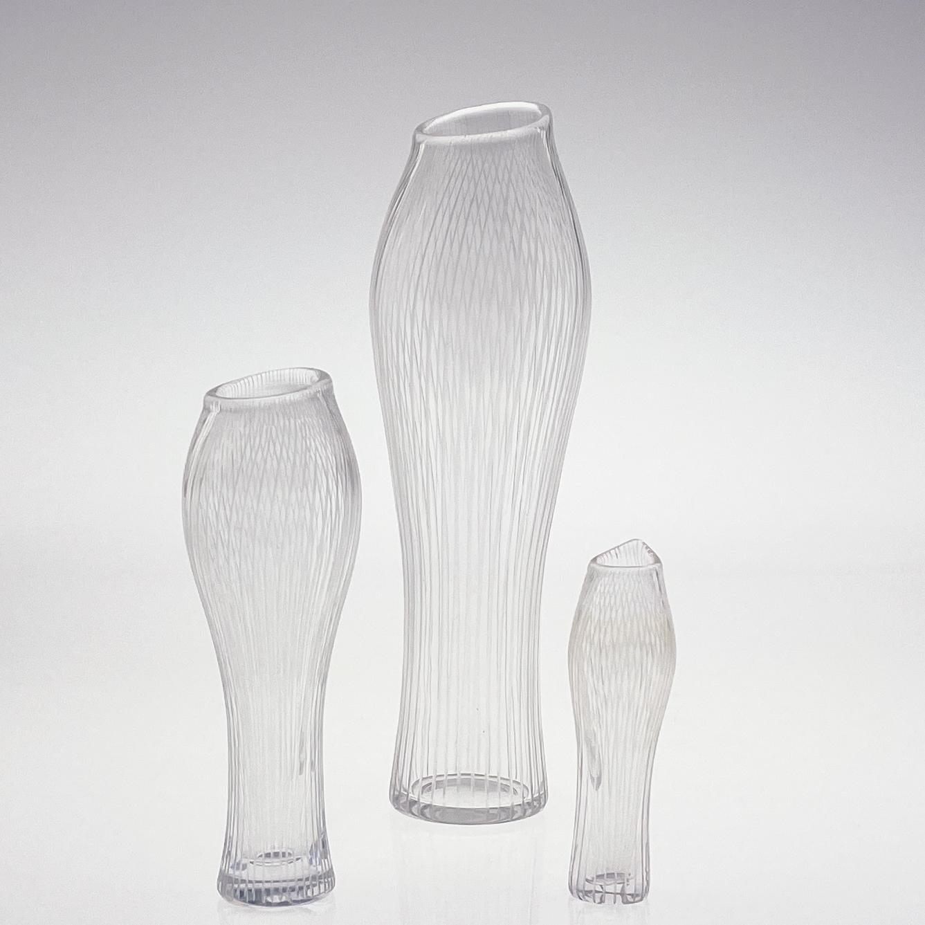 Scandinavian Modern Tapio Wirkkala Two Line Cut Crystal Art vases Handblown 

A complete set of all sizes –  turned mold-blown crystal – Artobject “Varsanjalka” or “Foals Foot” with vertical cut lines. This Art-object is model 3215 in the oeuvre of