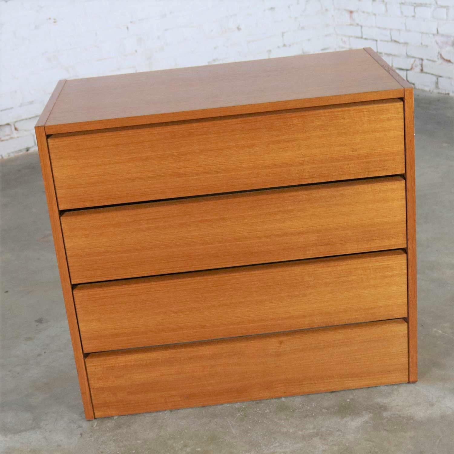 Handsome small Scandinavian Modern teak three-drawer chest marked made in Denmark. It is in wonderful vintage condition with no outstanding flaws that we have detected. Please see photos, circa 1970s-1980s.

Sometimes you just need a perfect small