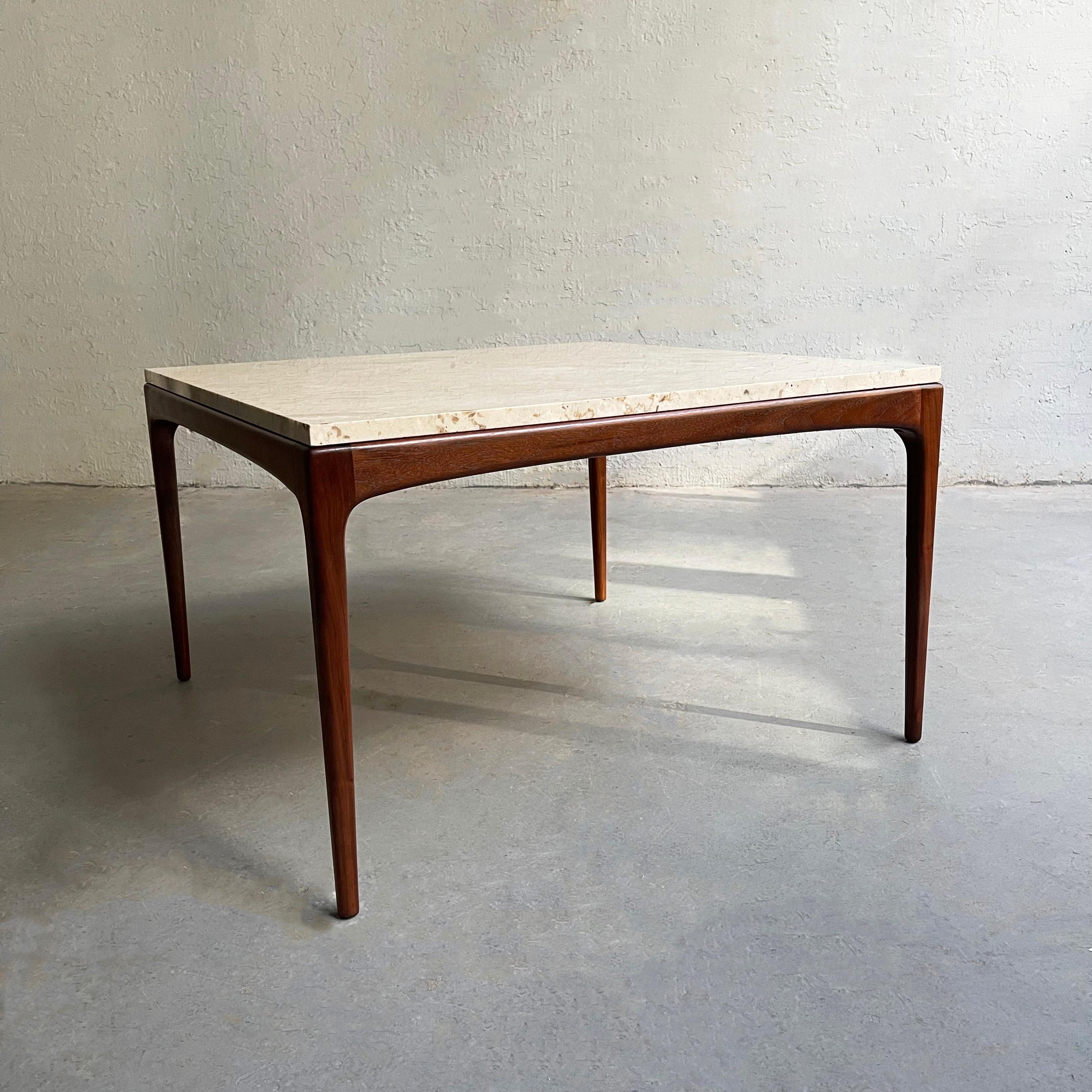 Danish modern coffee table features a square, beige marble top that rests on a slender teak frame with tapered legs.