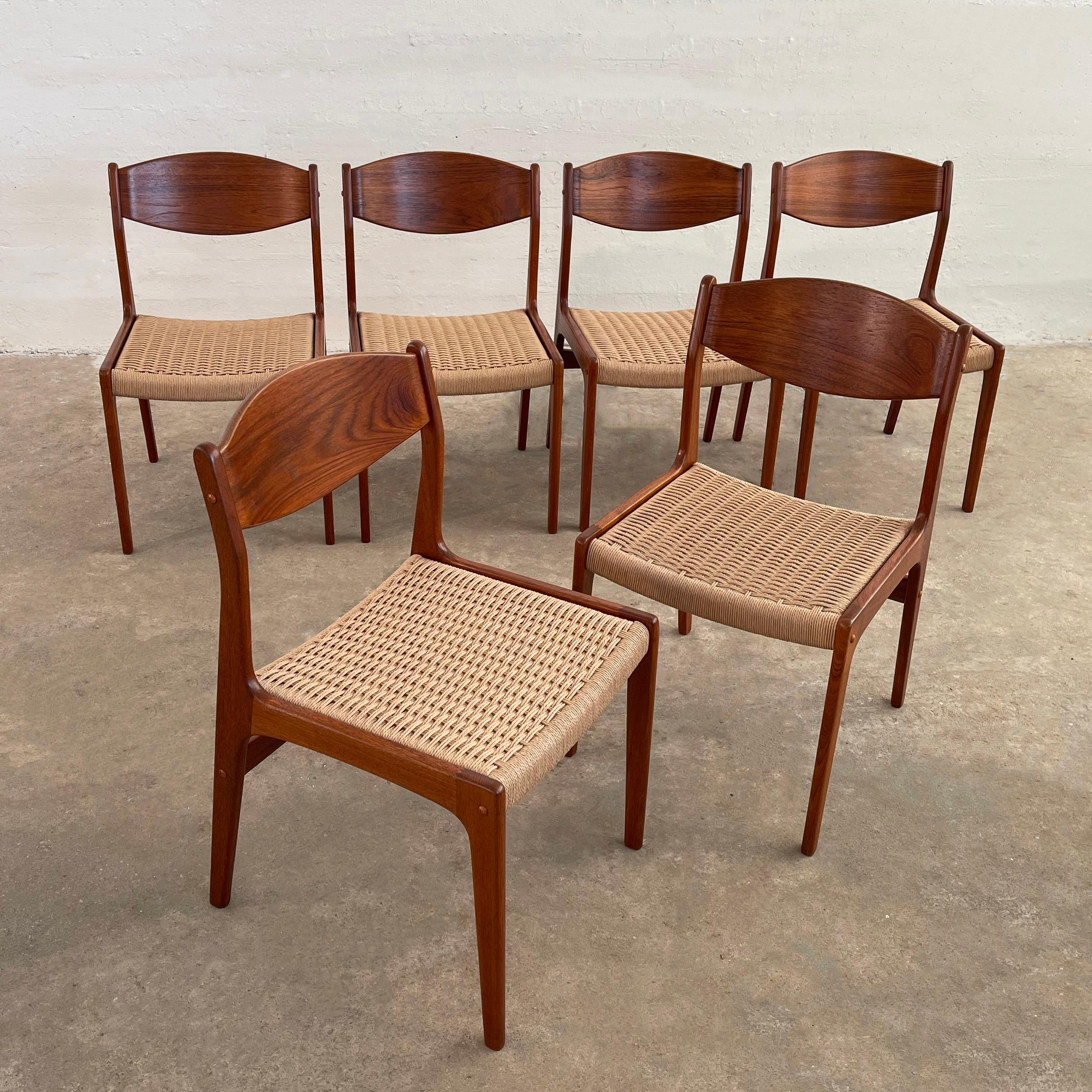 Stunning set of six Scandinavian modern, dining side chairs feature elegantly sculpted teak frames with contoured backs and newly woven rope seats. 