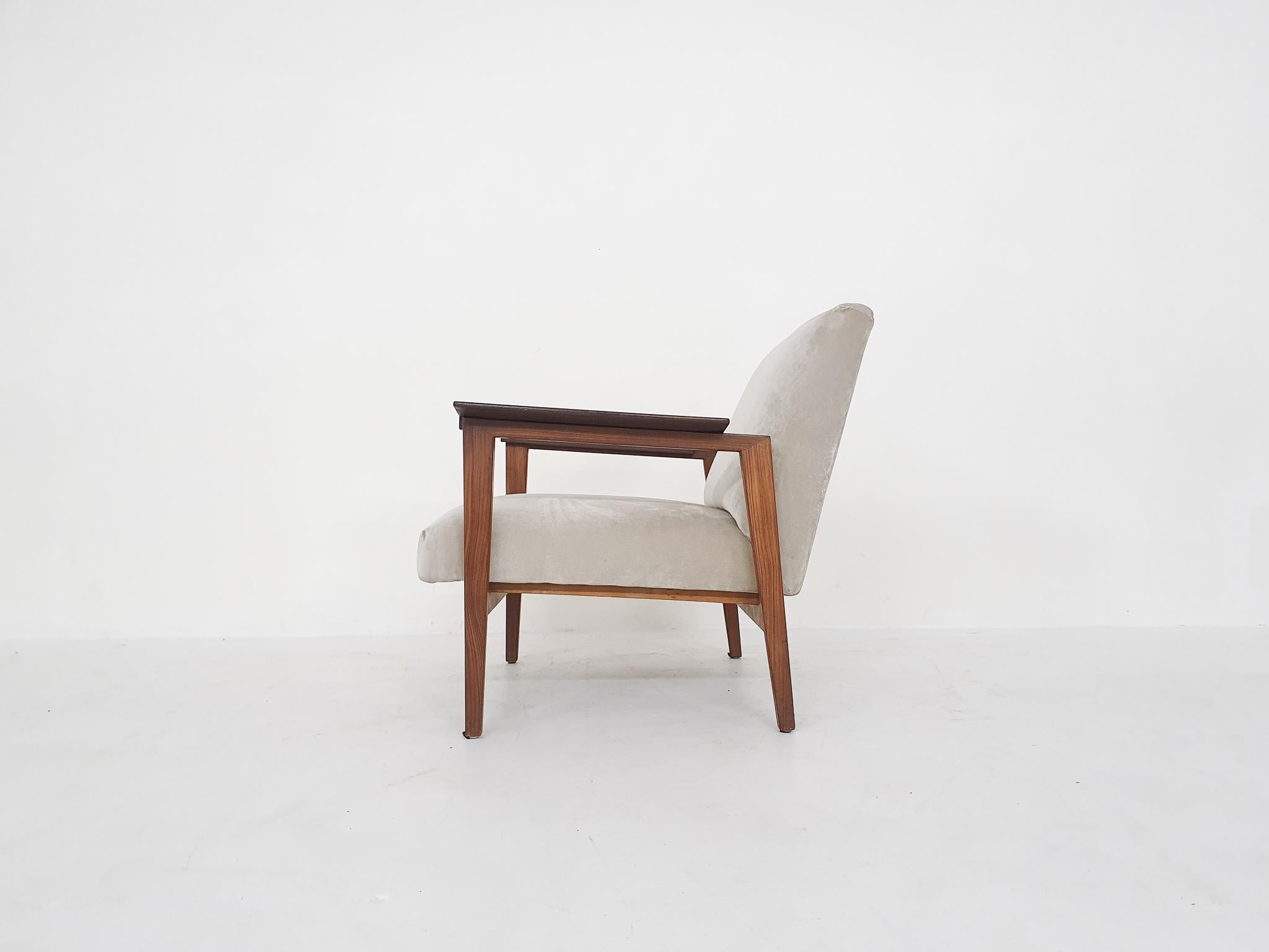 Teak lounge chair from the 1960's with new beige velvet upholstery.