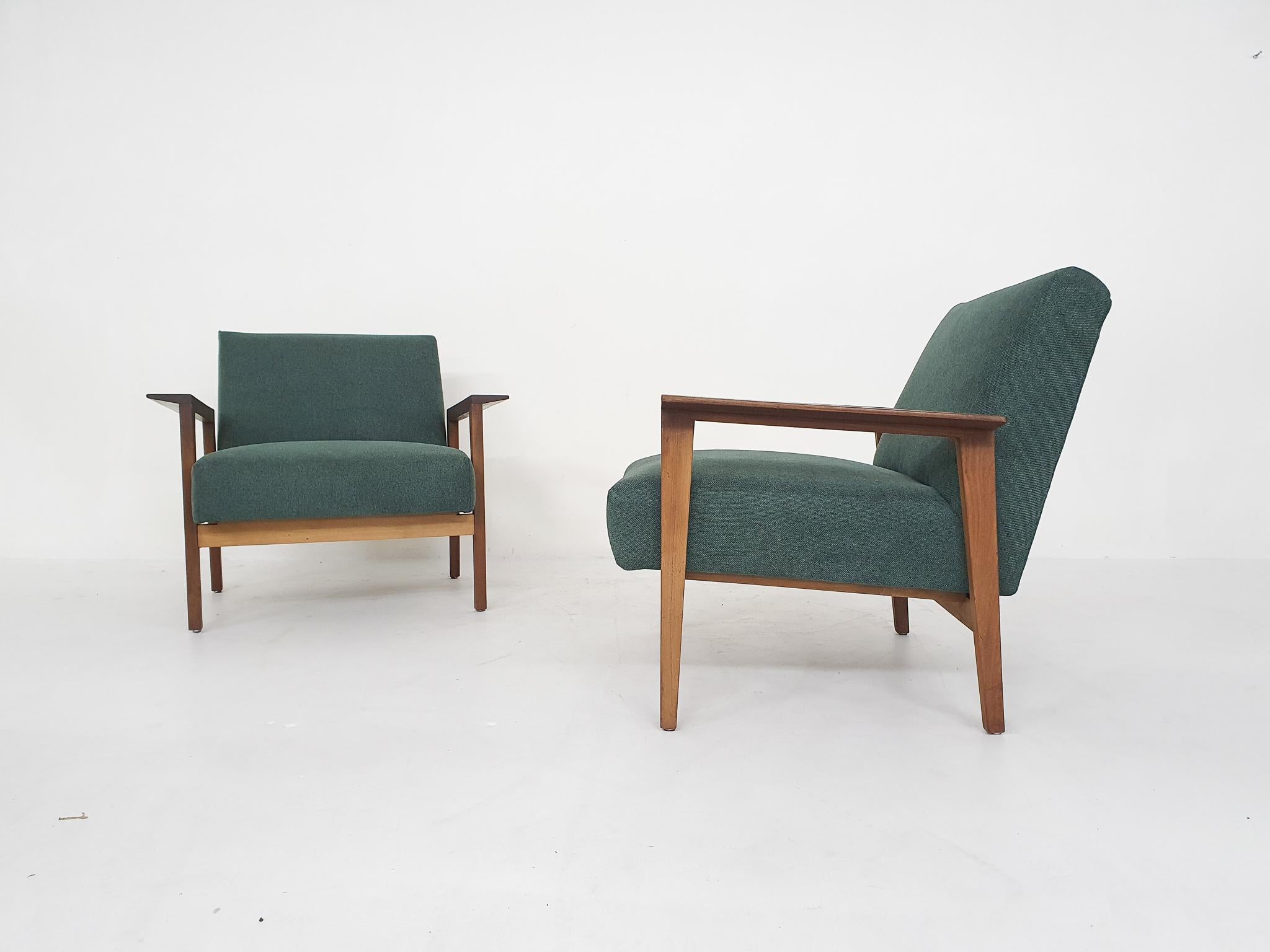 Teak lounge chairs from the 1960's with new green upholstery.