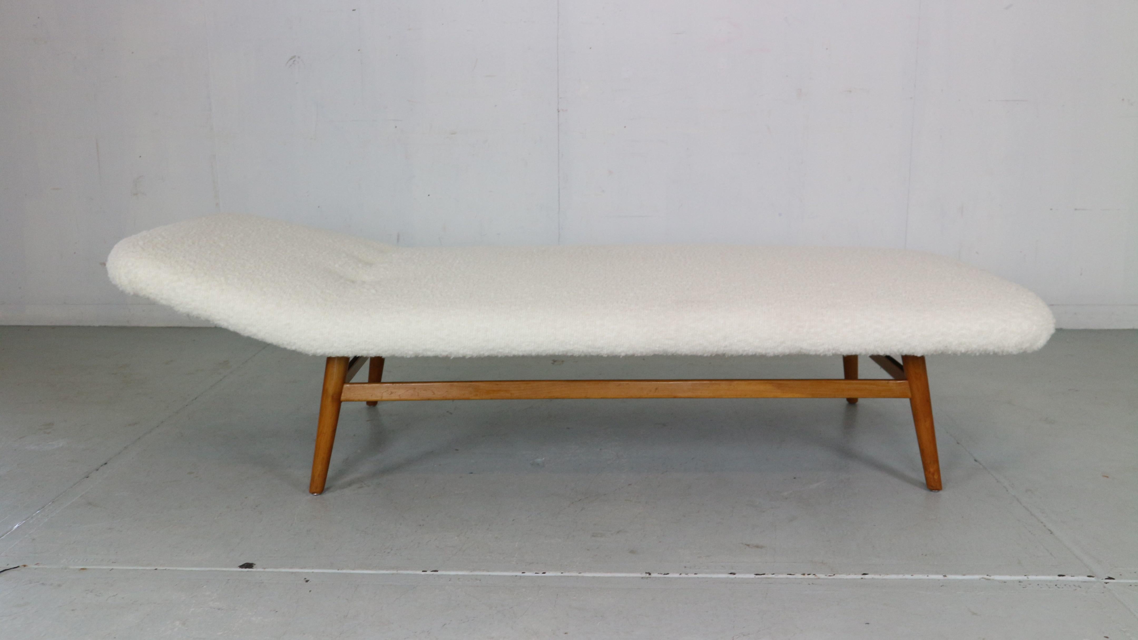 Scandinavian Modern period daybed made in 1960's period, Denmark.

The daybed frame is made of teak curved wood and the top surface has been newly reupholstered in white Boucle fabric.

 