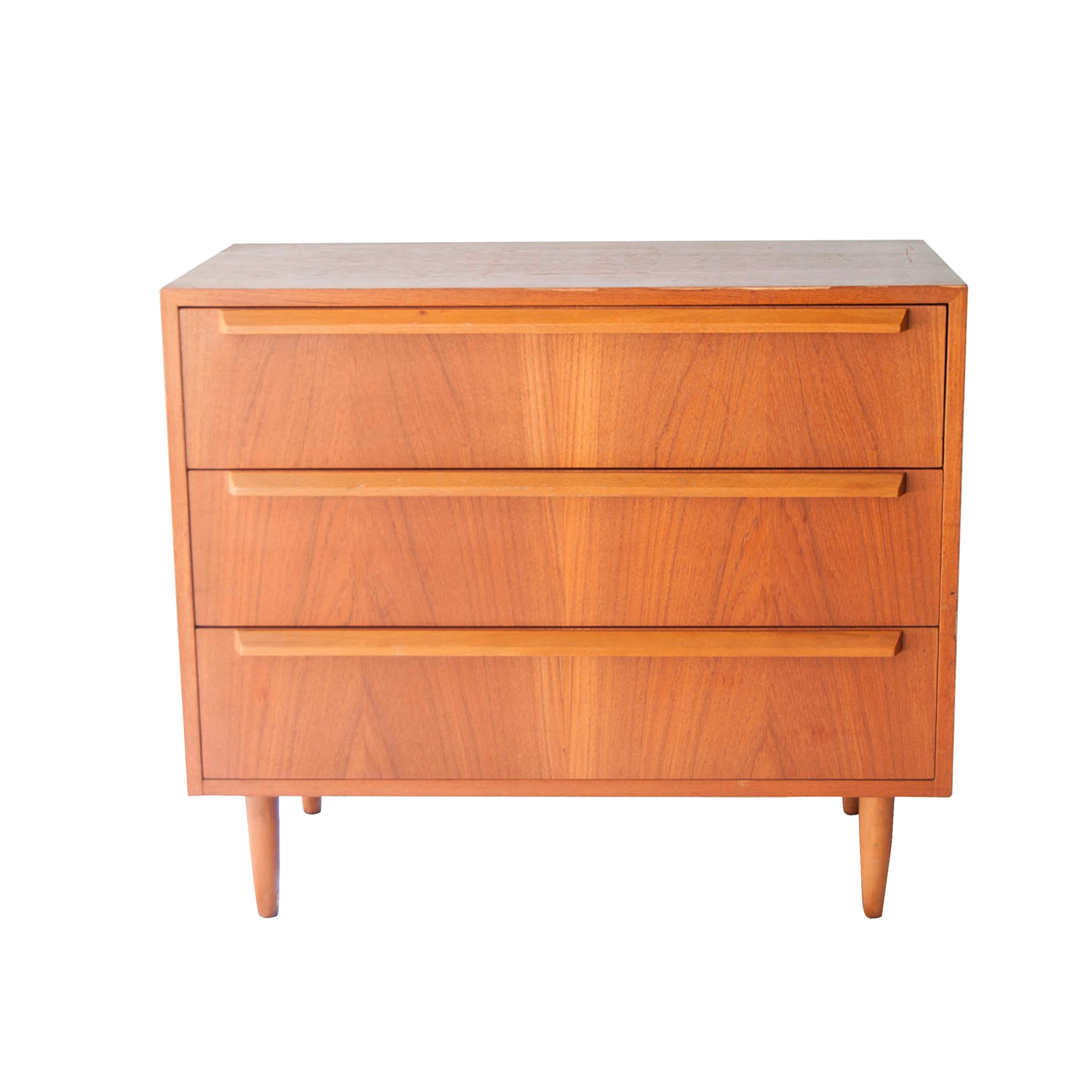 Scandinavian tree-drawer sideboard, made of Teak wood, with conical legs and handcrafted handles.