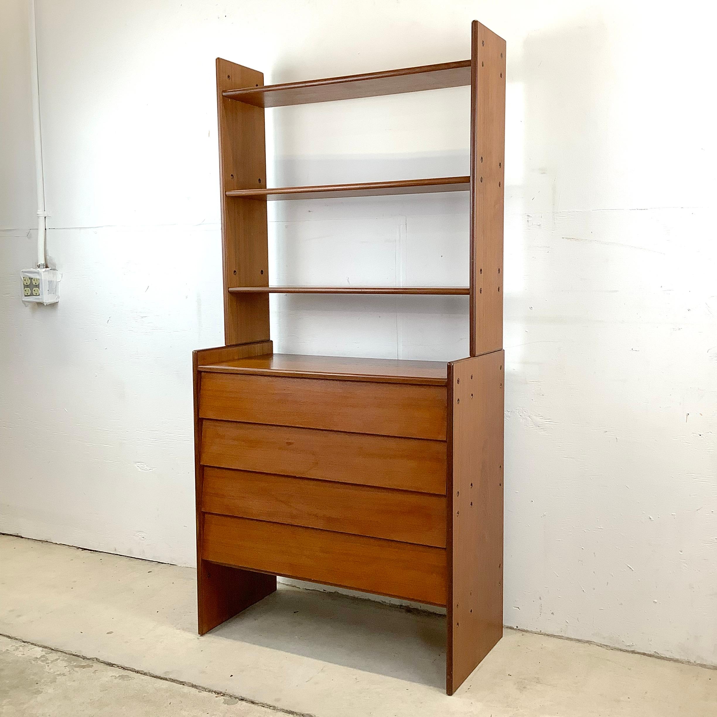 The simple elegance of this mid-century modern Scandinavian teak chest of drawers is highlighted in the clean modern lines, louvered style drawer fronts, and quality two tone wood choice. The unique assembly style of both the chest of drawers and