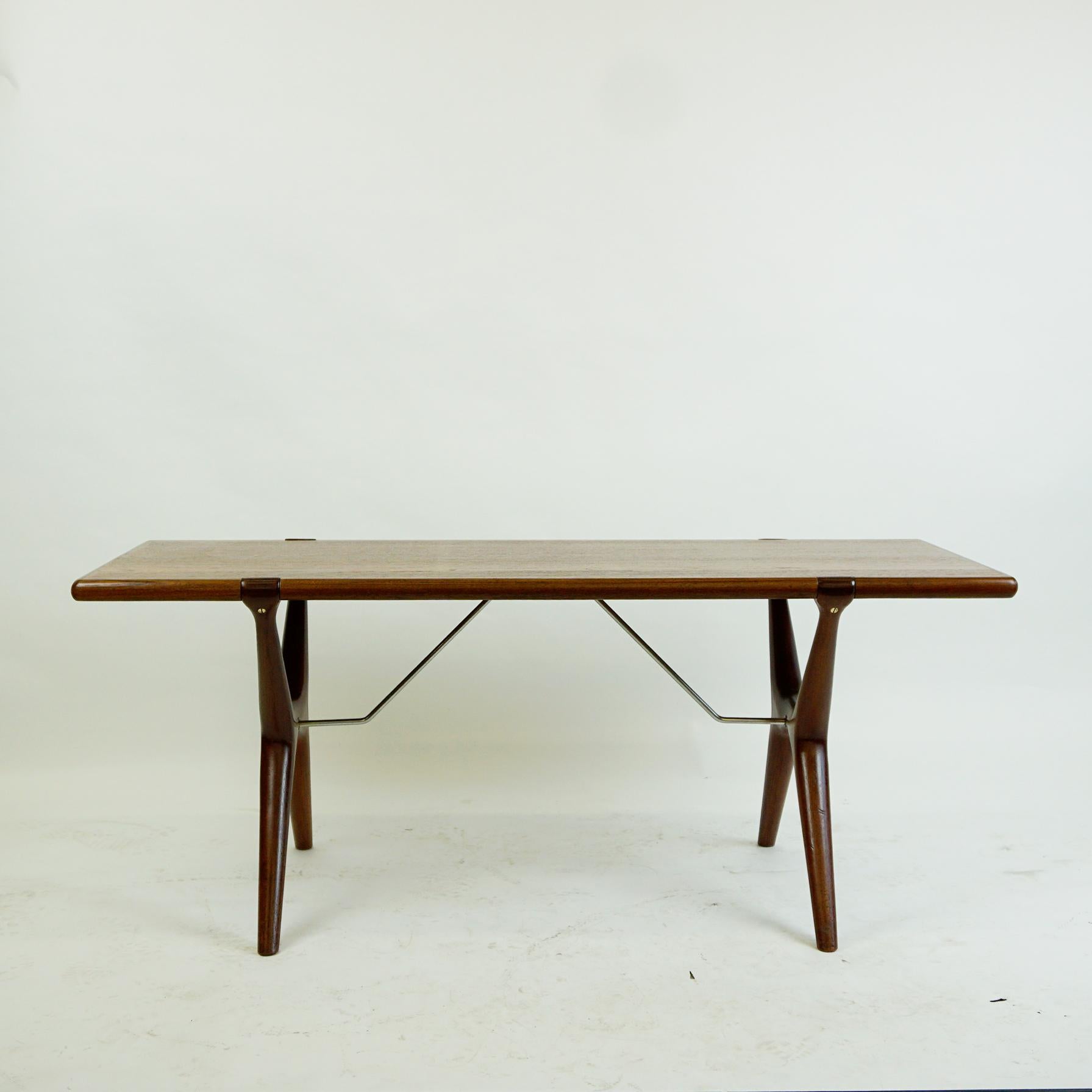 Excellent handcrafted teak coffee table designed in the 1960s by Carl Erik Ekselius for J.O.C. Vetlanda.
It features a teak veneered top with solid teak organic shaped X-base legs and metal stretchers.
A perfect highlight for any Scandinavian and