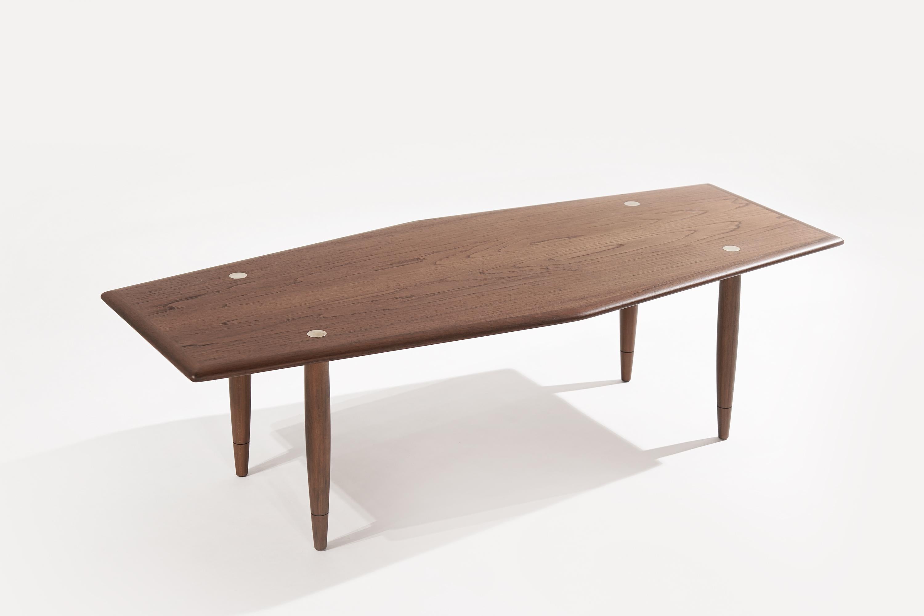 An exquisitely rare coffee table, executed in teak designed by Yngve Ekström for Dux, featuring brass accents. Completely restored.

Other designers from this period include Finn Juhl, Vladimir Kagan, Hans Wegner, Gio Ponti, and Ico Parisi.