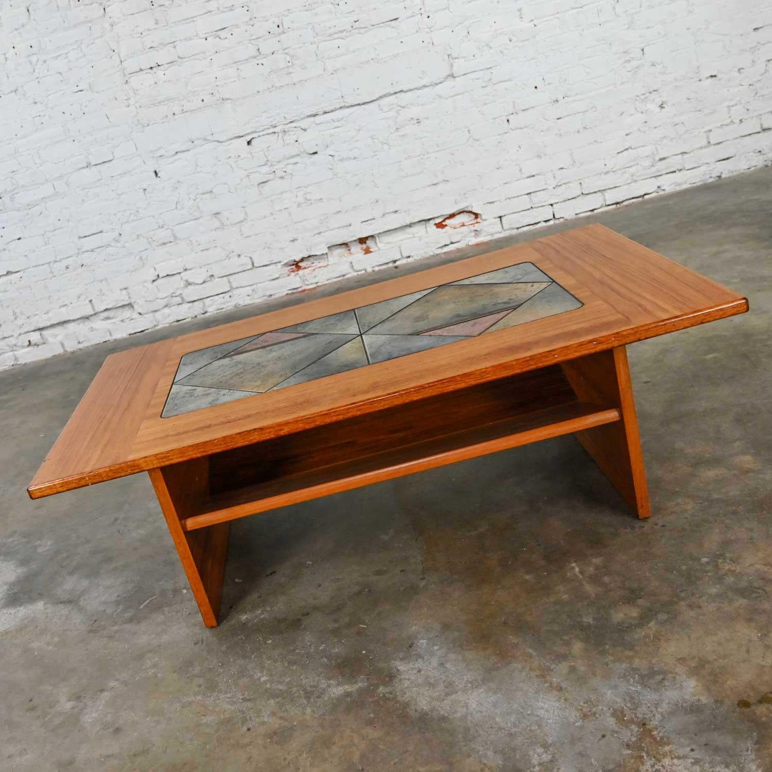 Fabulous Scandinavian Modern teak coffee table with tile insert for Gangso Mobler. Beautiful condition, keeping in mind that this is vintage and not new so will have signs of use and wear. It has had a coat of polyurethane and there are a few