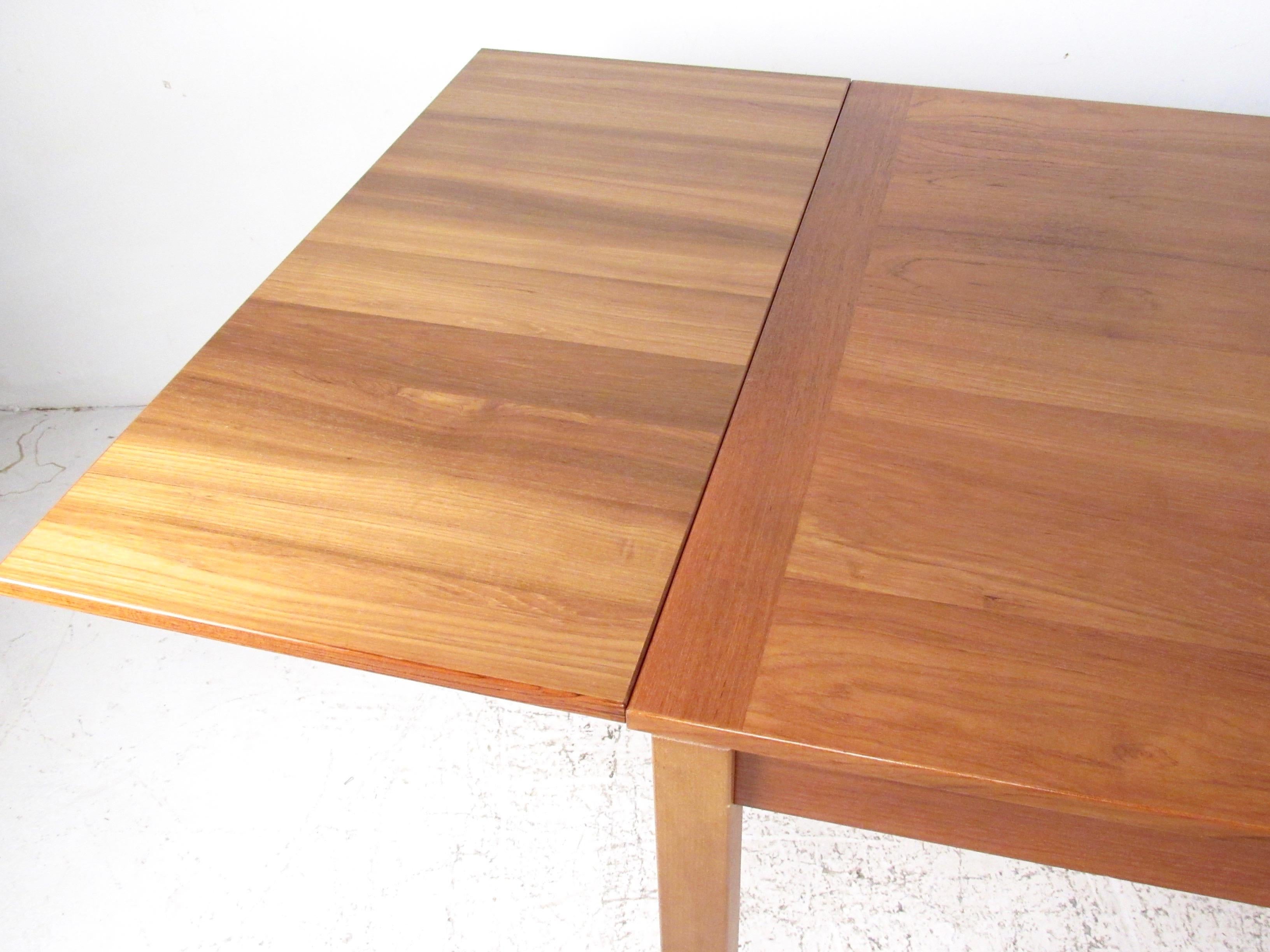 Danish Scandinavian Modern Teak Dining Table with Draw Leaf Extension