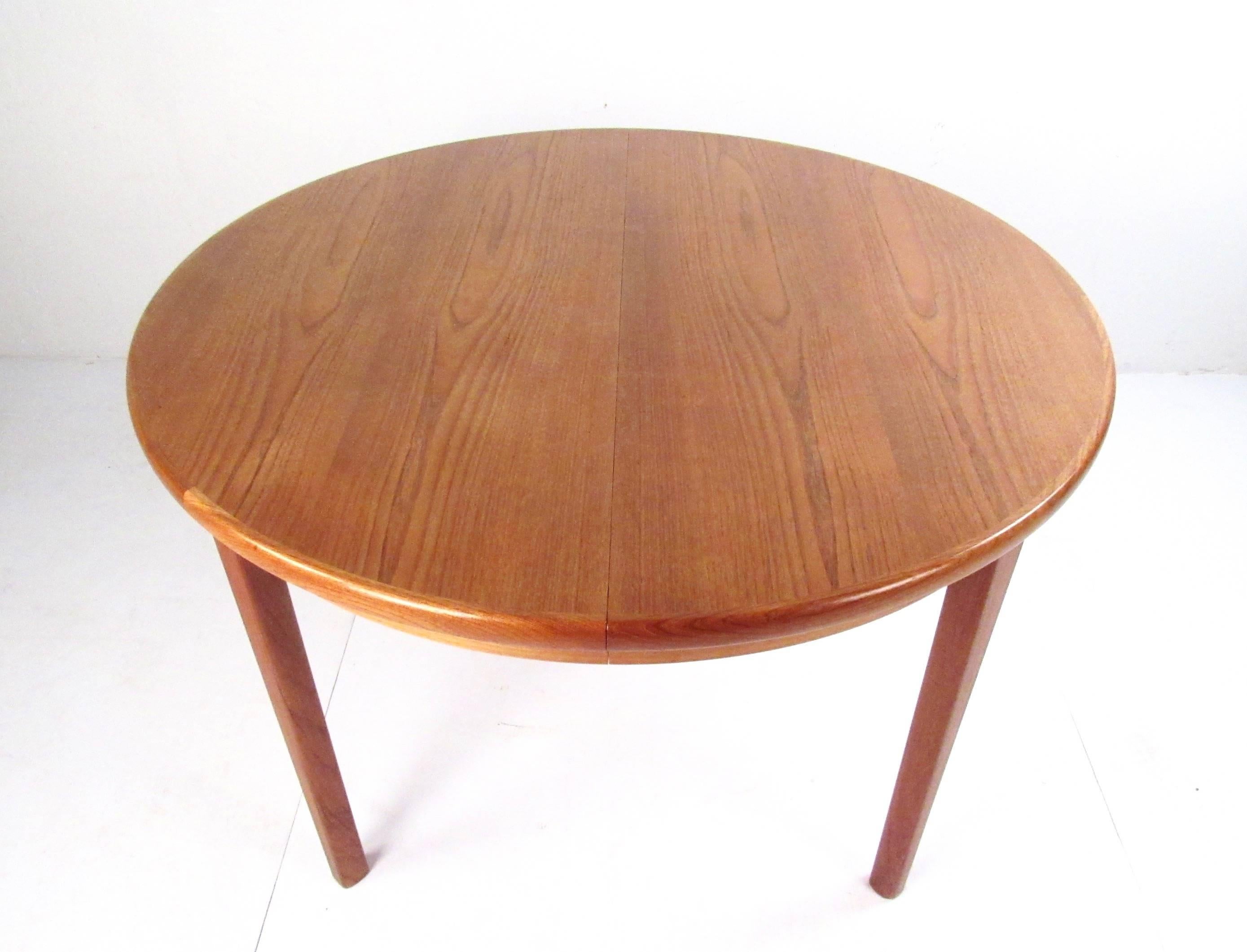 This stylish modern teak table makes a versatile addition to kitchen or dining room, features rich Danish teak wood grain and expandable design. Opening from a circular 46.5 inch table to 86 inches wide, it's easy to accommodate place settings for