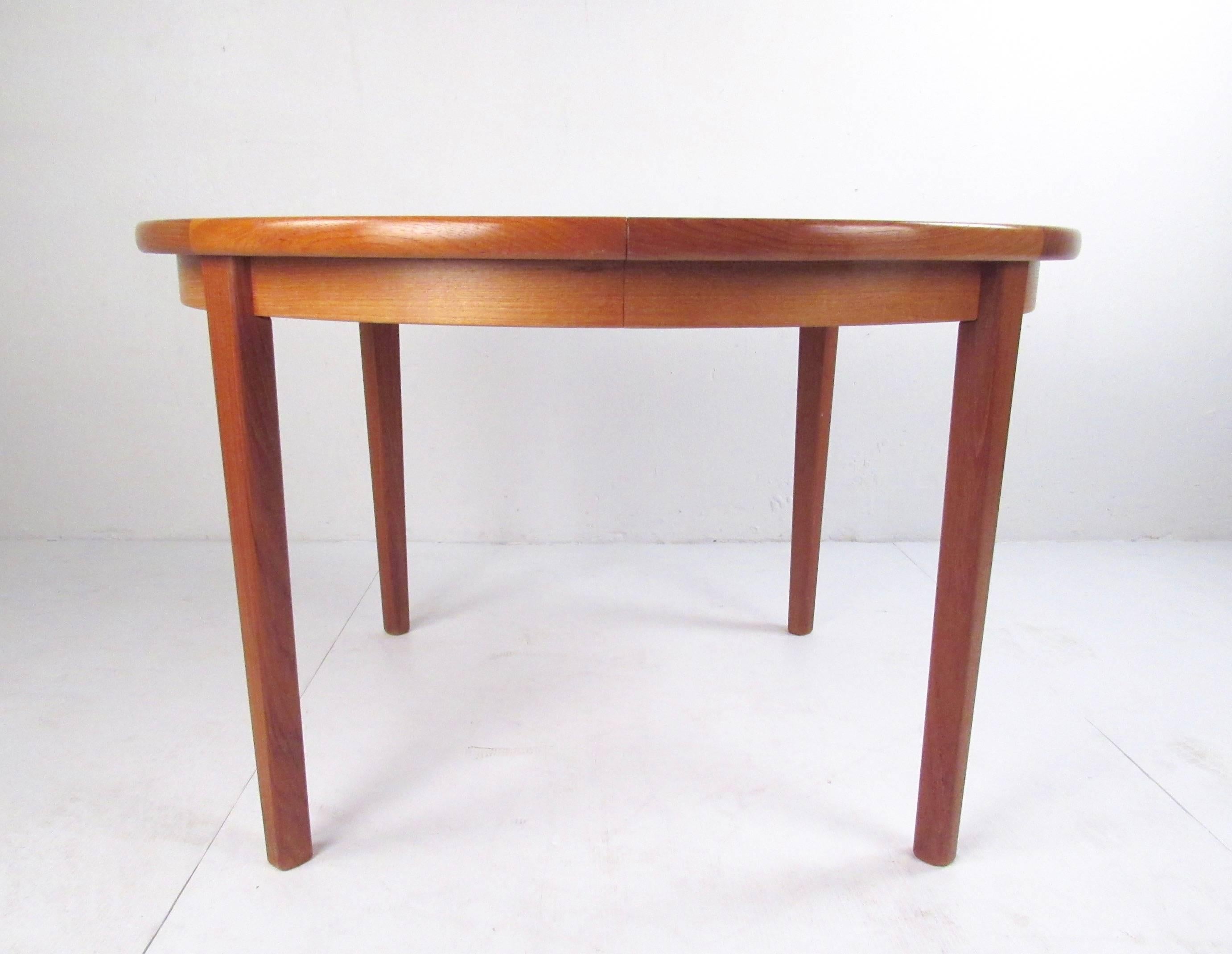 Danish Scandinavian Modern Teak Dining Table with Two Leaves