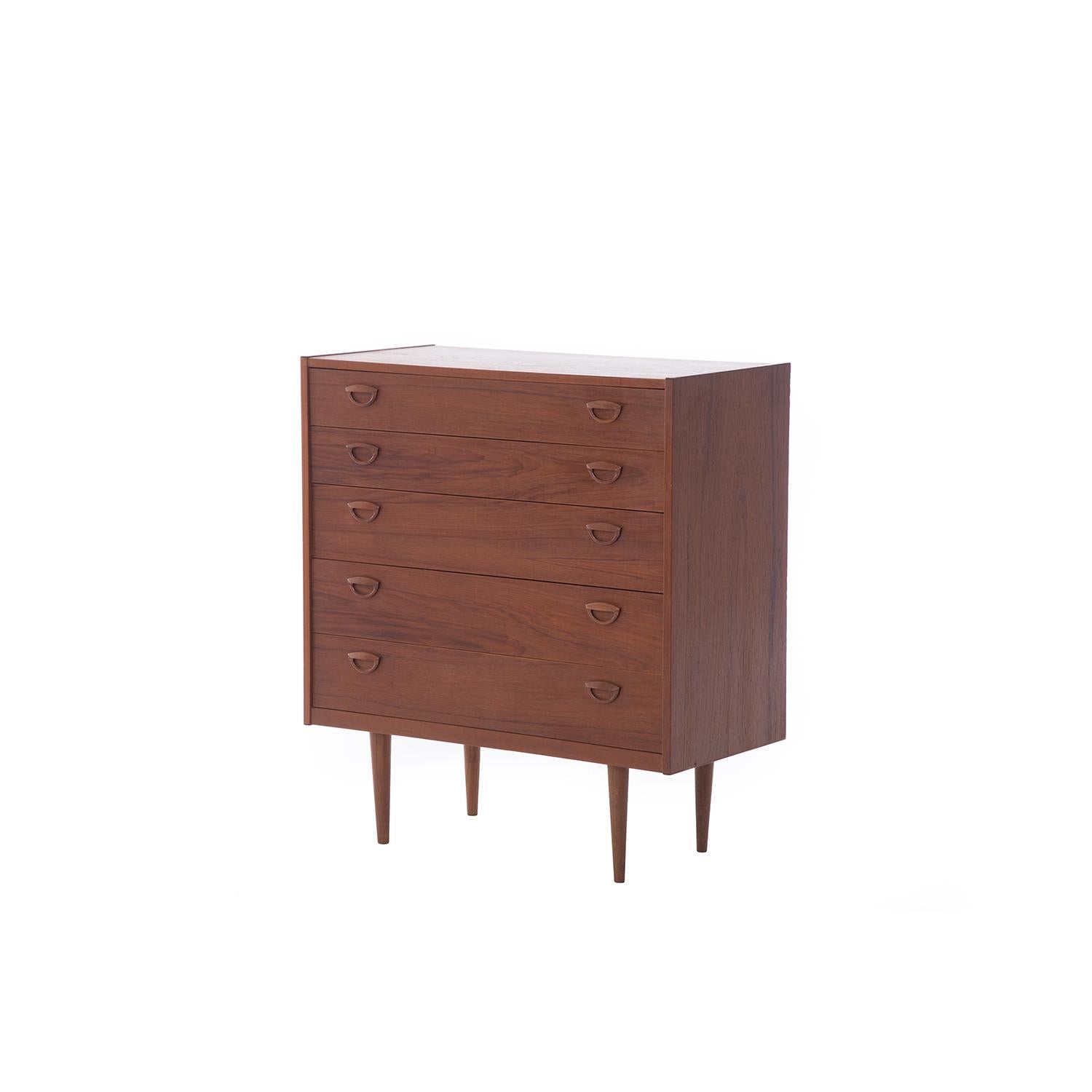 This is a classic mid-century Scandinavian teak drawer chest designed y Kai Kristiansen. Five drawers with sculptural finger pulls. Top and second drawer are 4