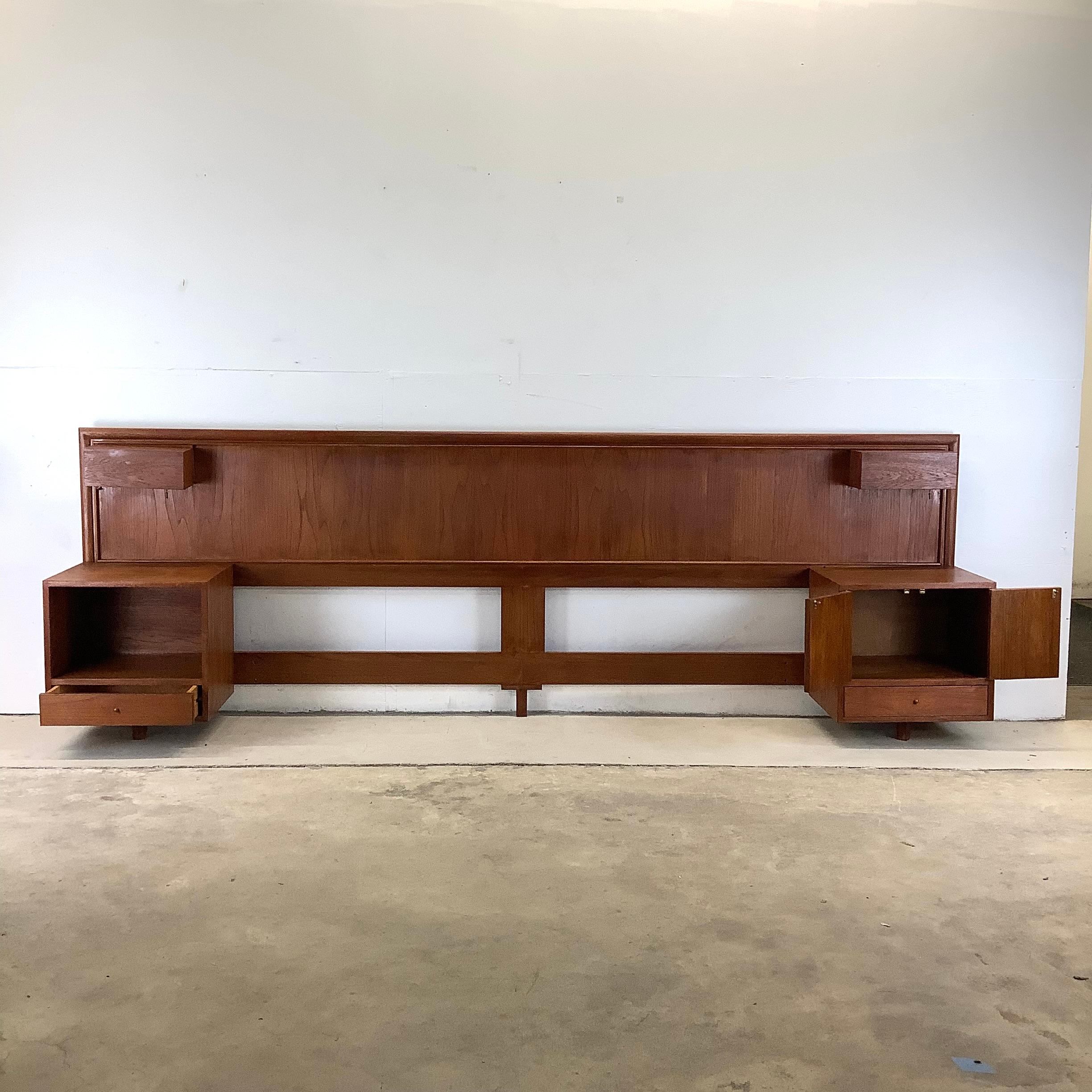 This unique Scandinavian Modern king size headboard with built-in nightstands features vintage teak construction and finish with clean mid-century modern style design. The dual bedside tables offer a combination of cabinet and drawer storage and