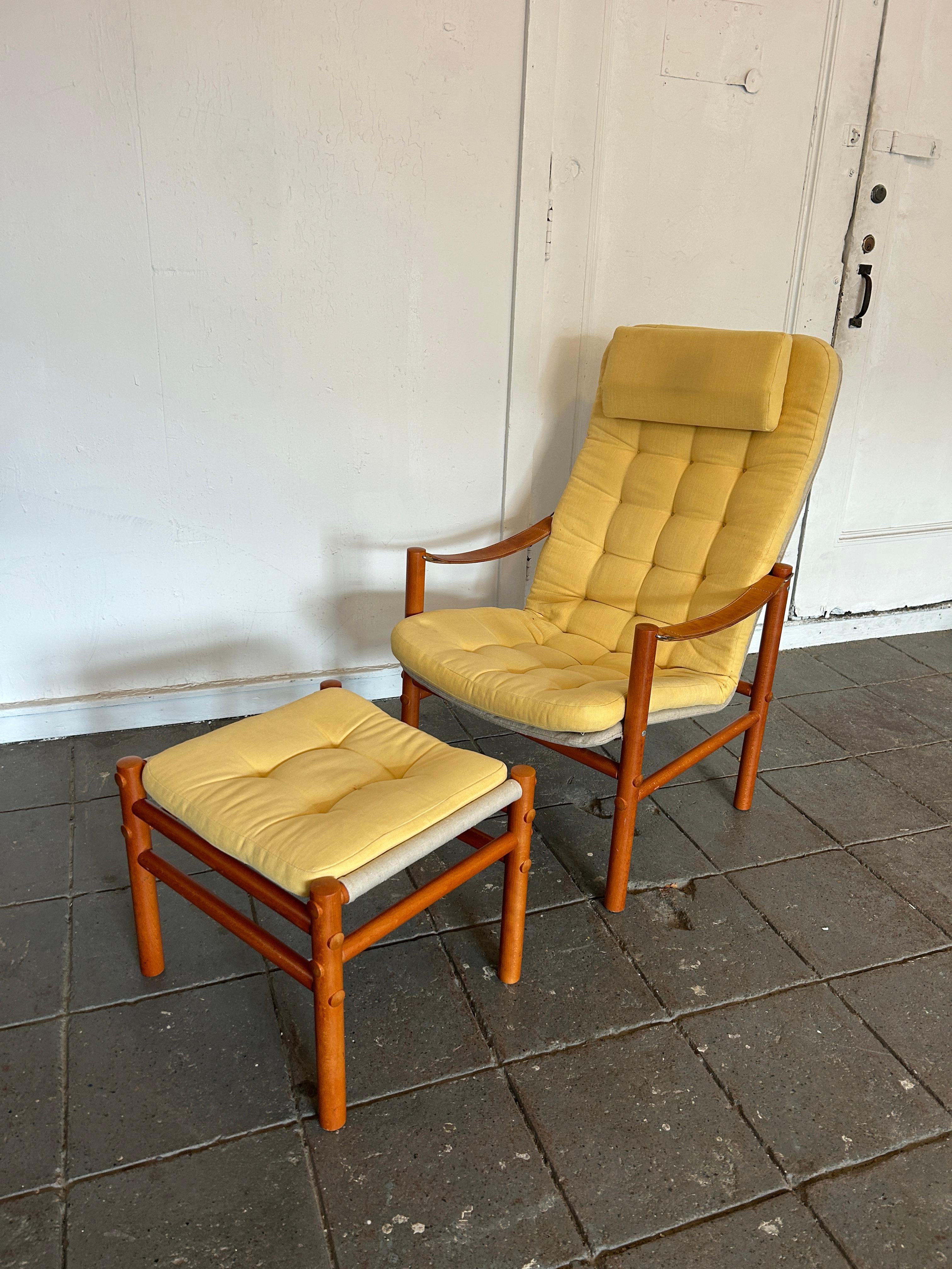 Scandinavian modern teak leather safari lounge chair with ottoman yellow upholstery. Very clean chair with thick leather strap armrests and solid teak frame. Chair and ottoman combination. Made in Norway. Located in Brooklyn NYC.

Chair measures