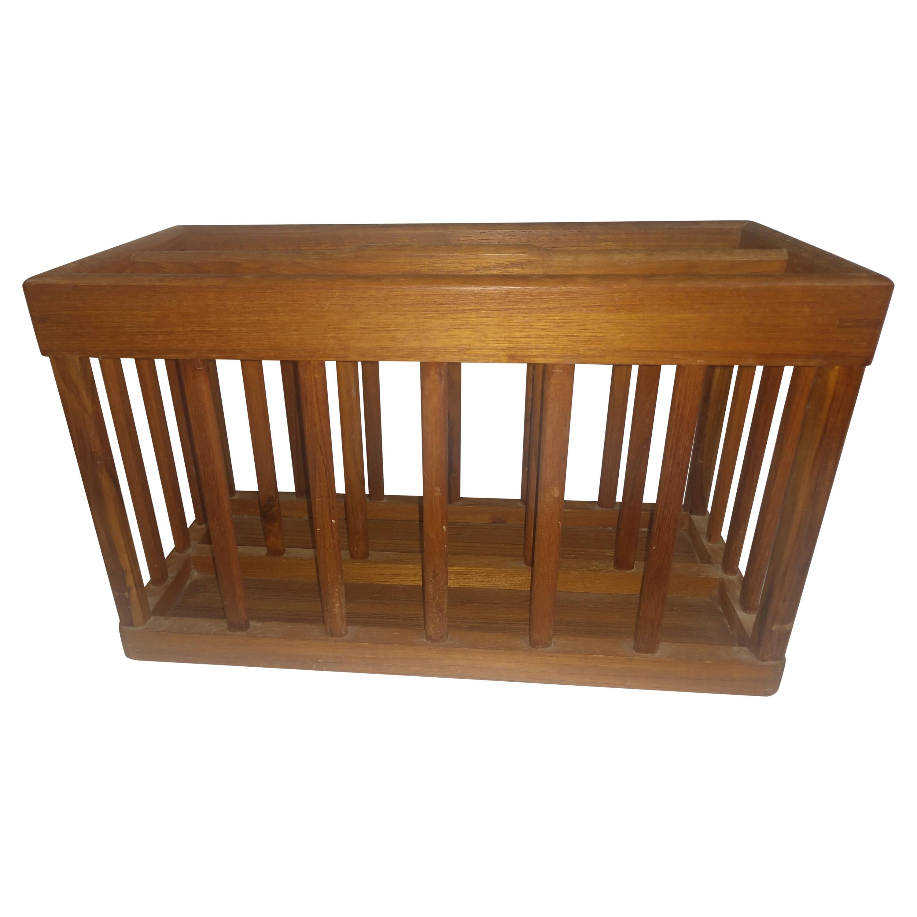 Sculpted flat spindles with splined corners are the details in this Scandinavian beauty. Signed Good Wood on bottom.