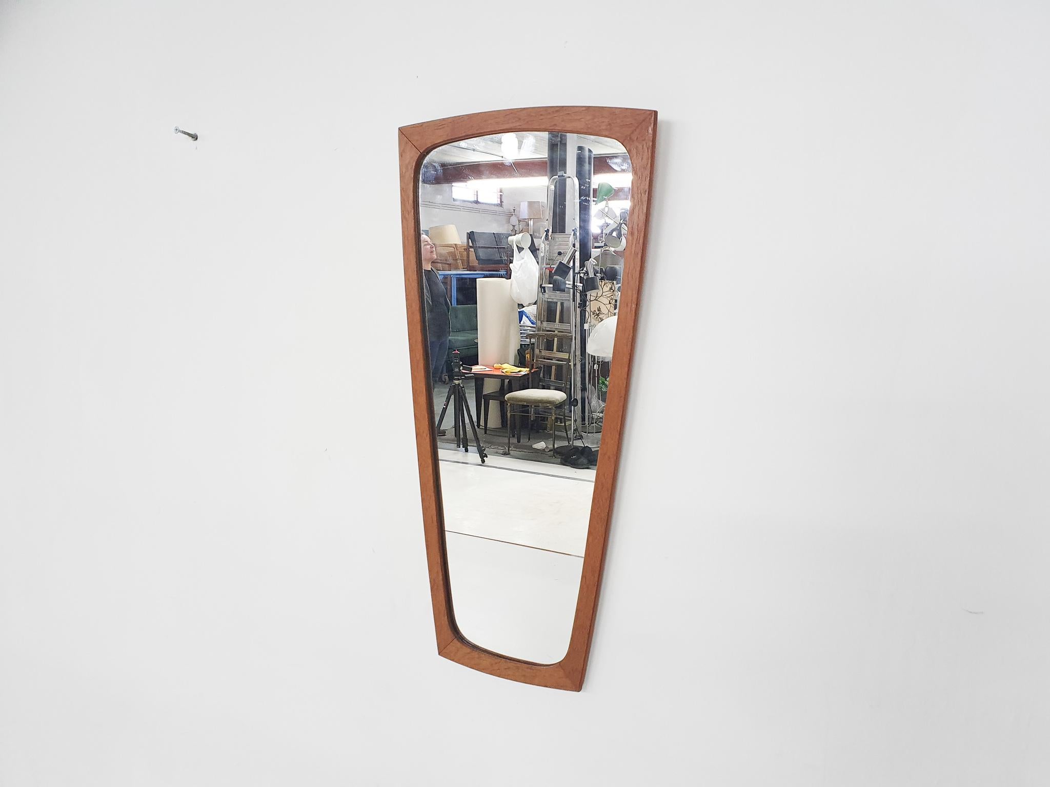 Elegant teak mirror in good condition.