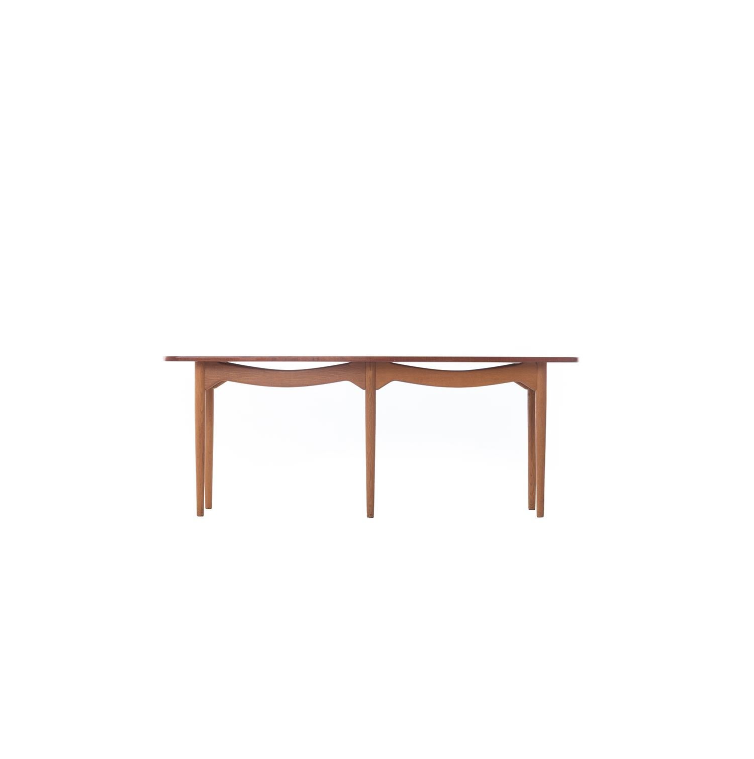 Rare Kurt Ostervig designed six-Legged coffee table with draped apron design and shield shaped teak top.  Old growth teak and white oak with a traditional Danish oil finish.  


Professional, skilled furniture restoration is an integral part of what