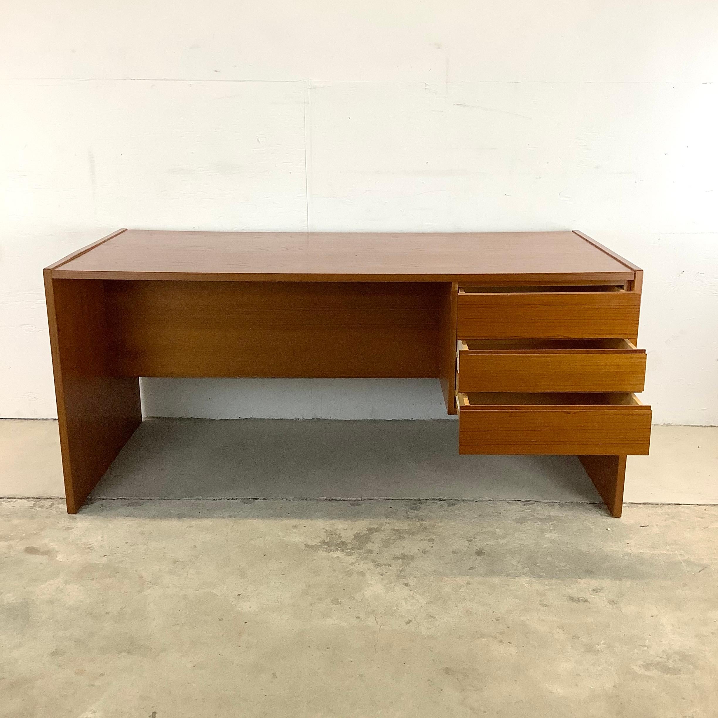 This striking Scandinavian Modern style office desk offers a wide workspace with right side drawers perfect for home office settings. The finished back of this large writing desk make it a good fit whether against the wall or floating mid-room. The