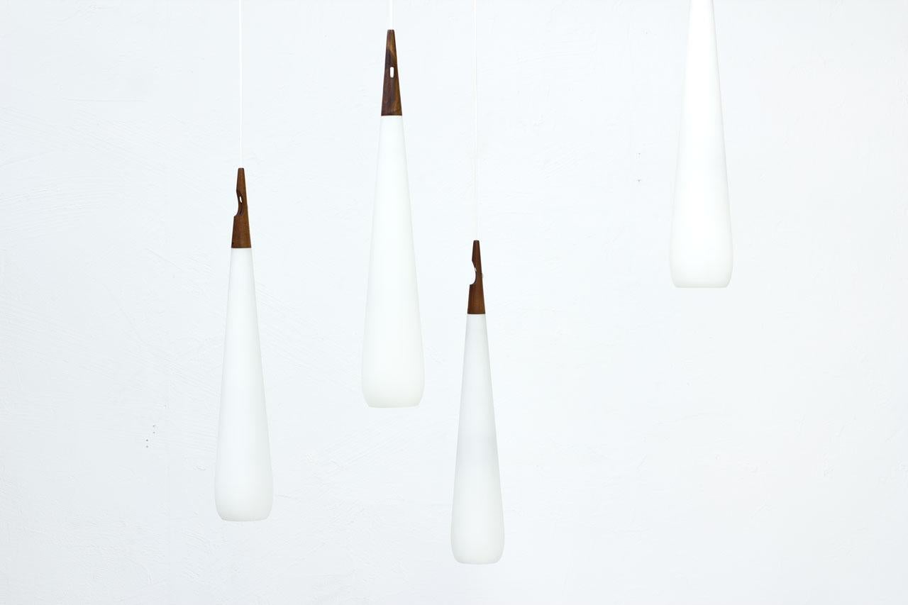 Swedish Scandinavian Modern & Teak Opaline Glass Pendant Lamps by Luxus, Sweden