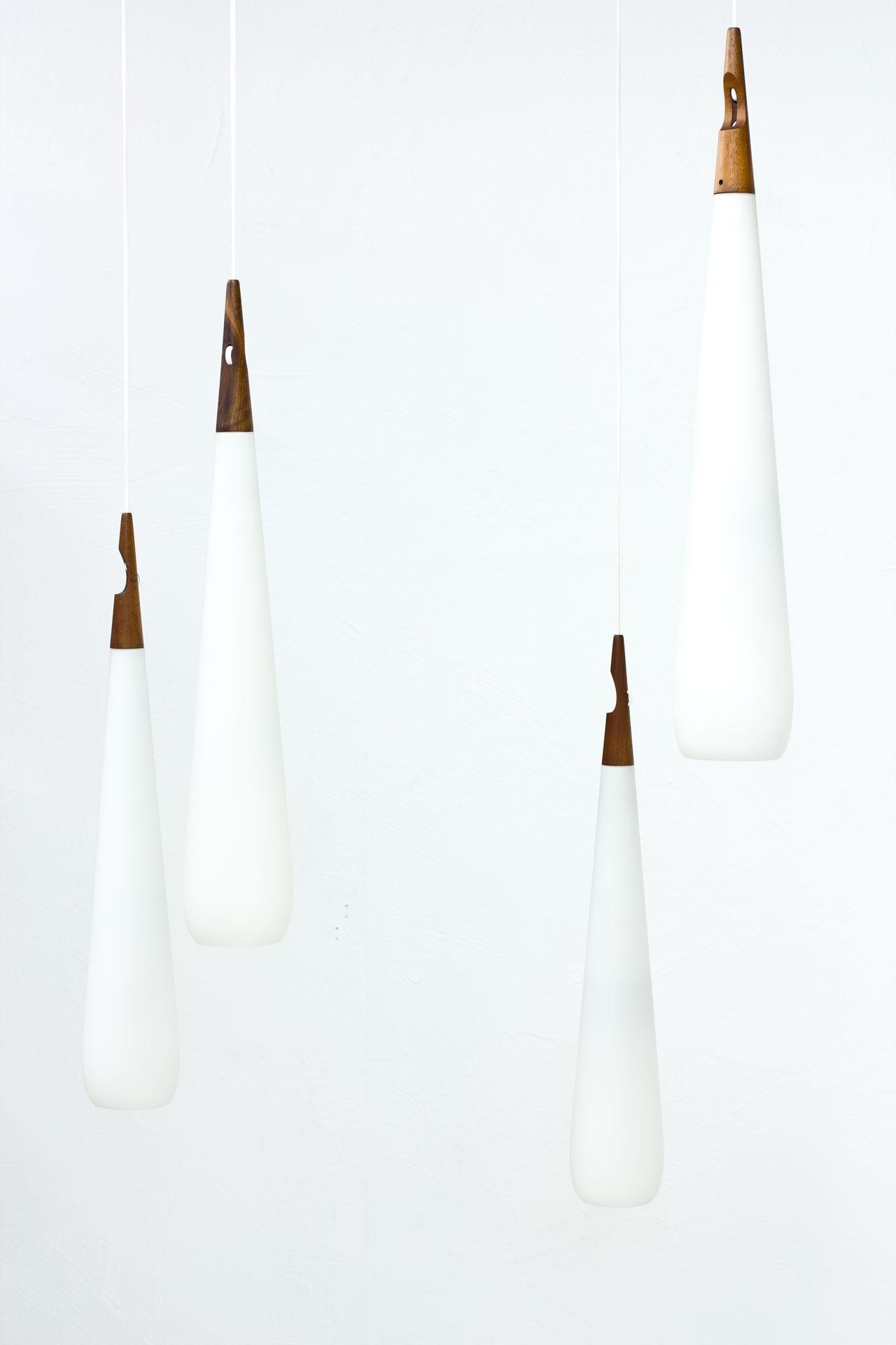 Scandinavian Modern & Teak Opaline Glass Pendant Lamps by Luxus, Sweden In Good Condition In Stockholm, SE